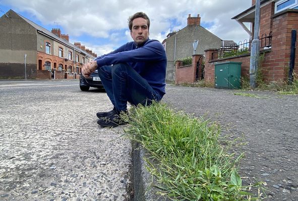 Beechmount residents demand action over overgrown weeds