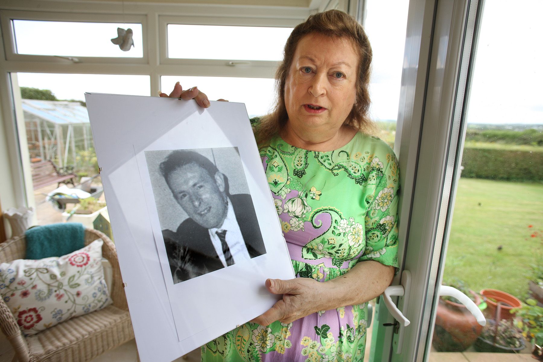 FIGHTING FOR JUSTICE: Patricia McVeigh holds a photograph of her father Patrick