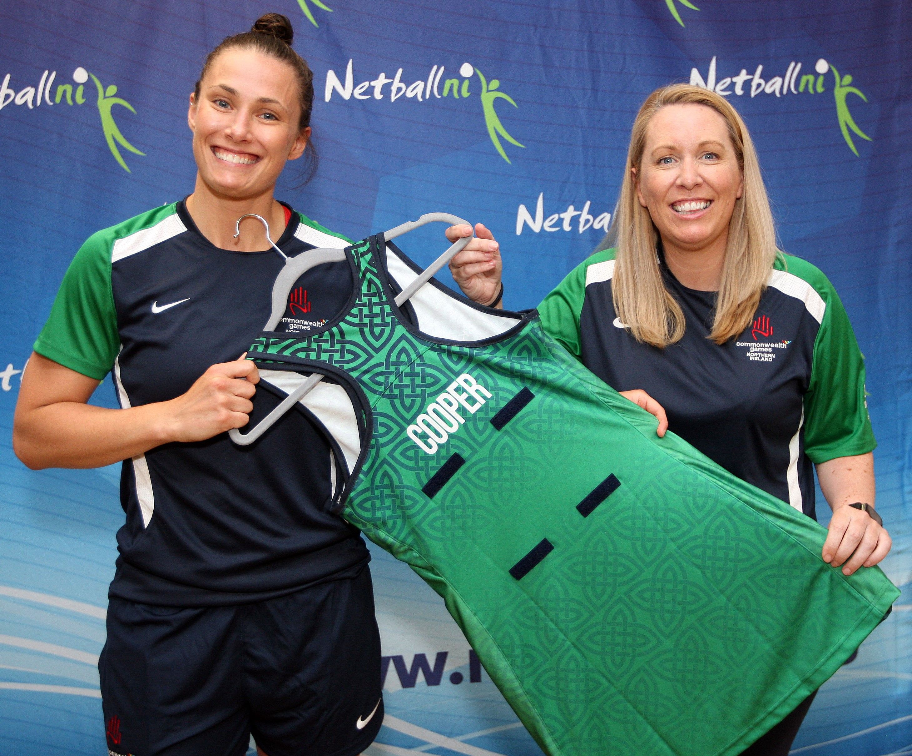 Team NI netballer Niamh Cooper is presented with her playing dress for the Commonwealth Games by Warriors head coach Elaine Rice
