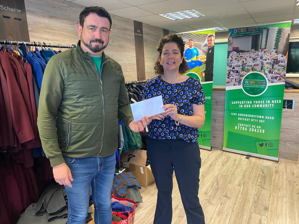DONATION: Sheena Joyce, manager SAG Credit Union, presents the prize to Paul Doherty of Foodstock