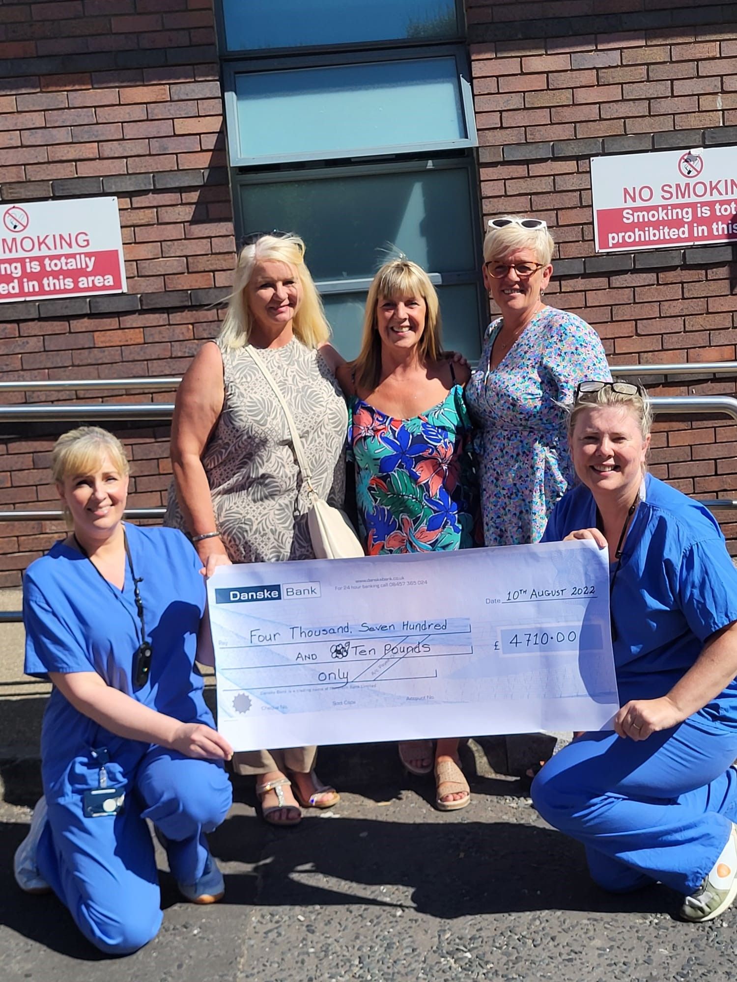 CHARITY: Briege Lyons, Sharon McCormick and Eileen Toner hand over the cheque to nurses from the RVH\'s neo-natal unit