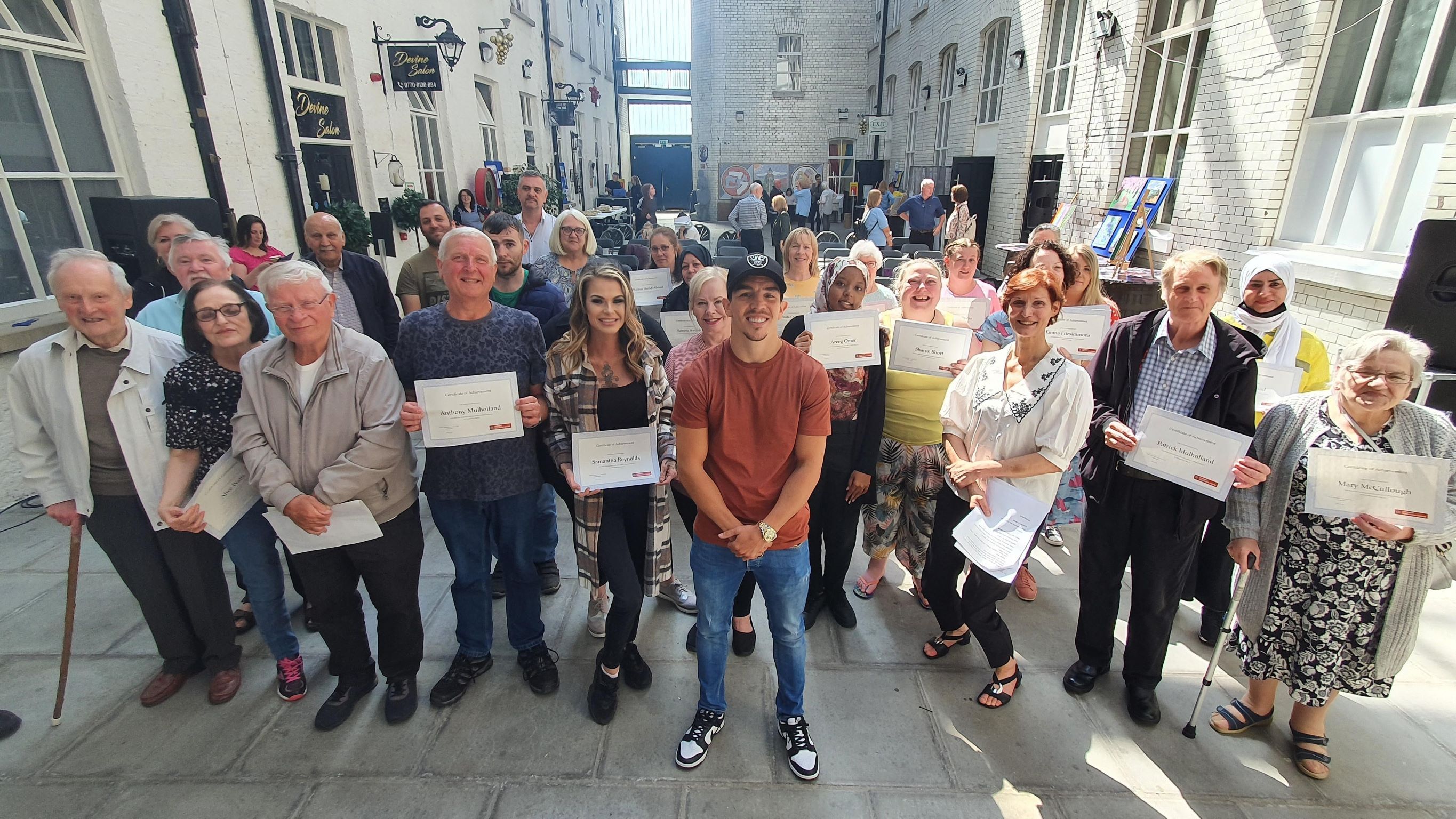 World boxing champion and Olympian Michael Conlon with Conway students and staff  at Celebration of Achievement June 2022