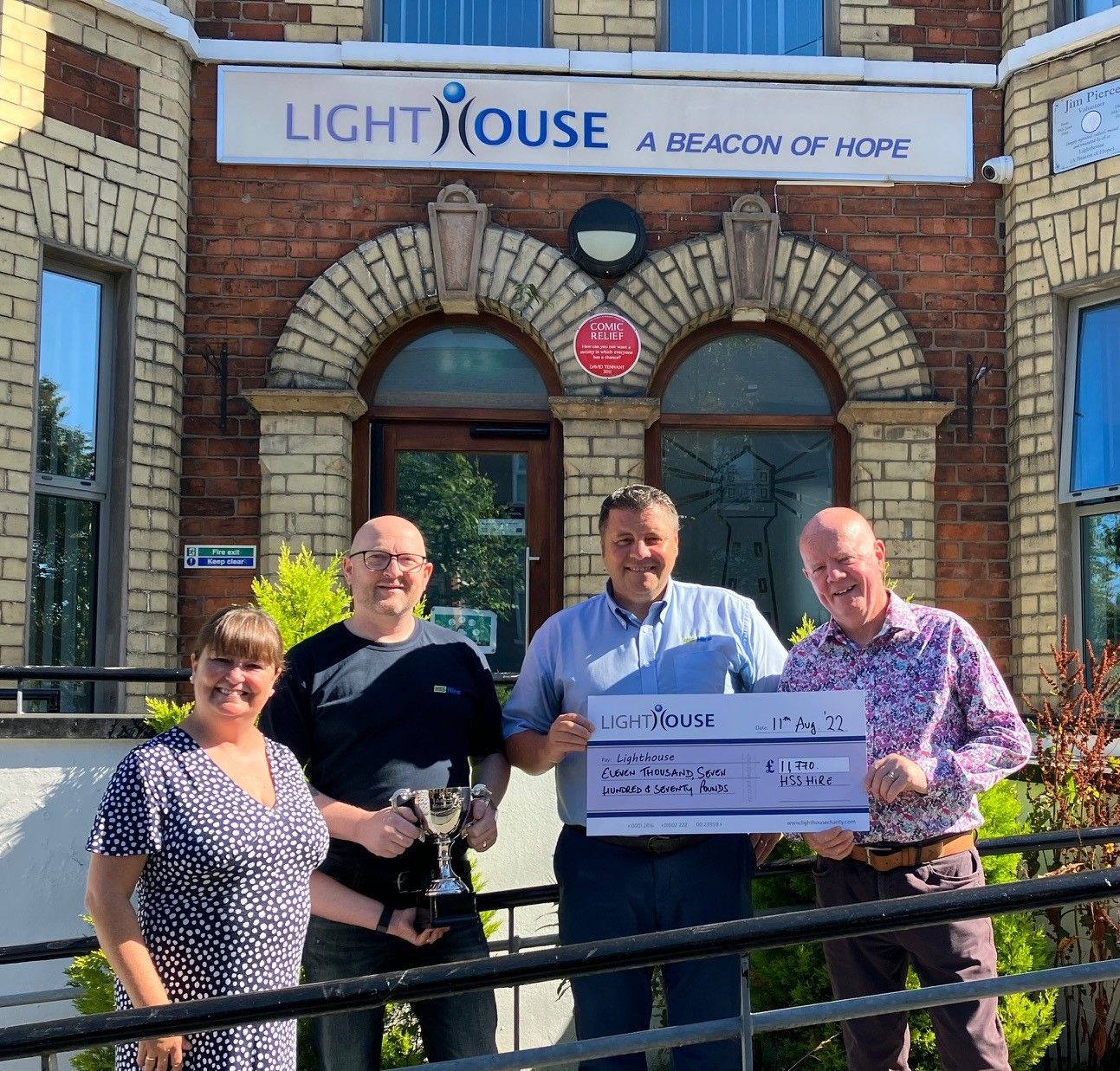 Ciarnan James and Paul Fox present a cheque to Lighthouse Executive Director, Paul Finnegan and fundraising lead Claire Hogarth