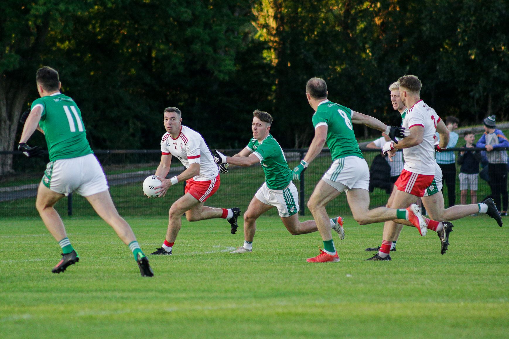 Declan Lynch looks to find a pass as Cargin players close in at Dunsilly on Friday 