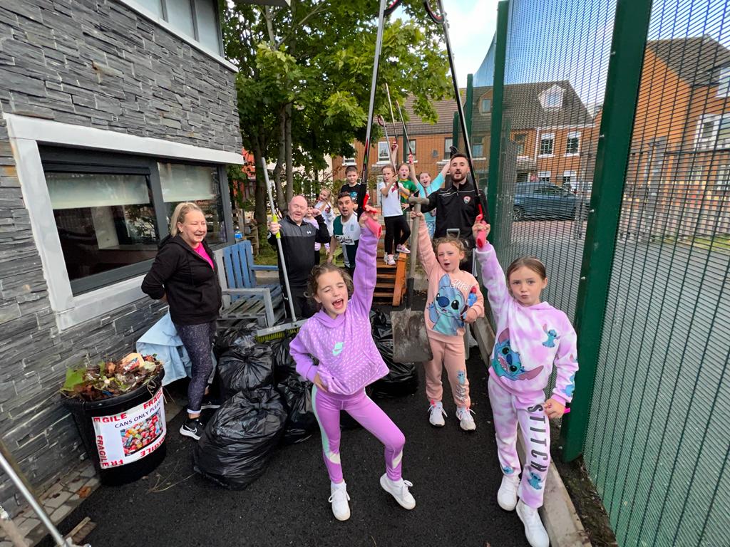 GETTING STUCK IN: St Malachy\'s Youth Centre and Market Development Association at the weekly community clean-up. 