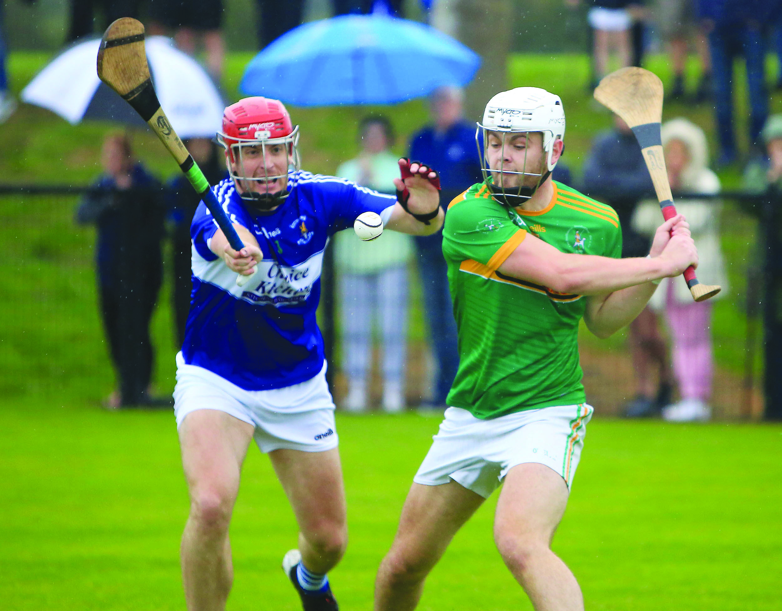 Ryan McNulty attempts to block down Ronan Molloy during last year’s semi-final meeting between St John’s and Dunloy at a sodden Dunsilly that the Cuchullains won with the help of Keelan Molloy’s 51st minute goal that finally ended the challenge of the 14-