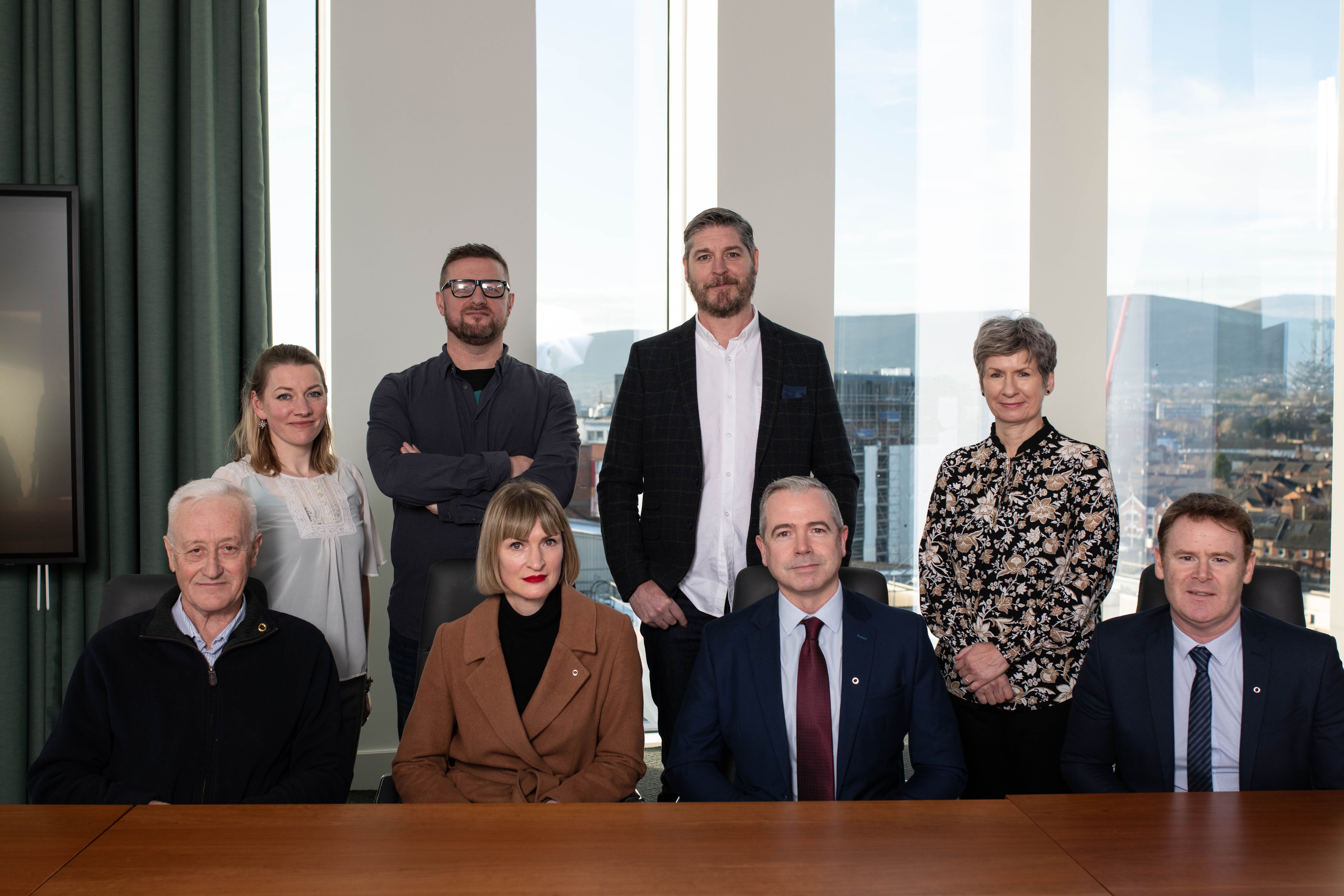 Gearóid Mac Liam, Faoileann Ní Dhuibhfinn, Fiona McCorry-Henry, Tim McCann and Michael King, along with An Droichead CEO Pól Deeds who presented the scholarships. Alison Snookes and Caoimhín Ó Dónaill from UU also pictured.