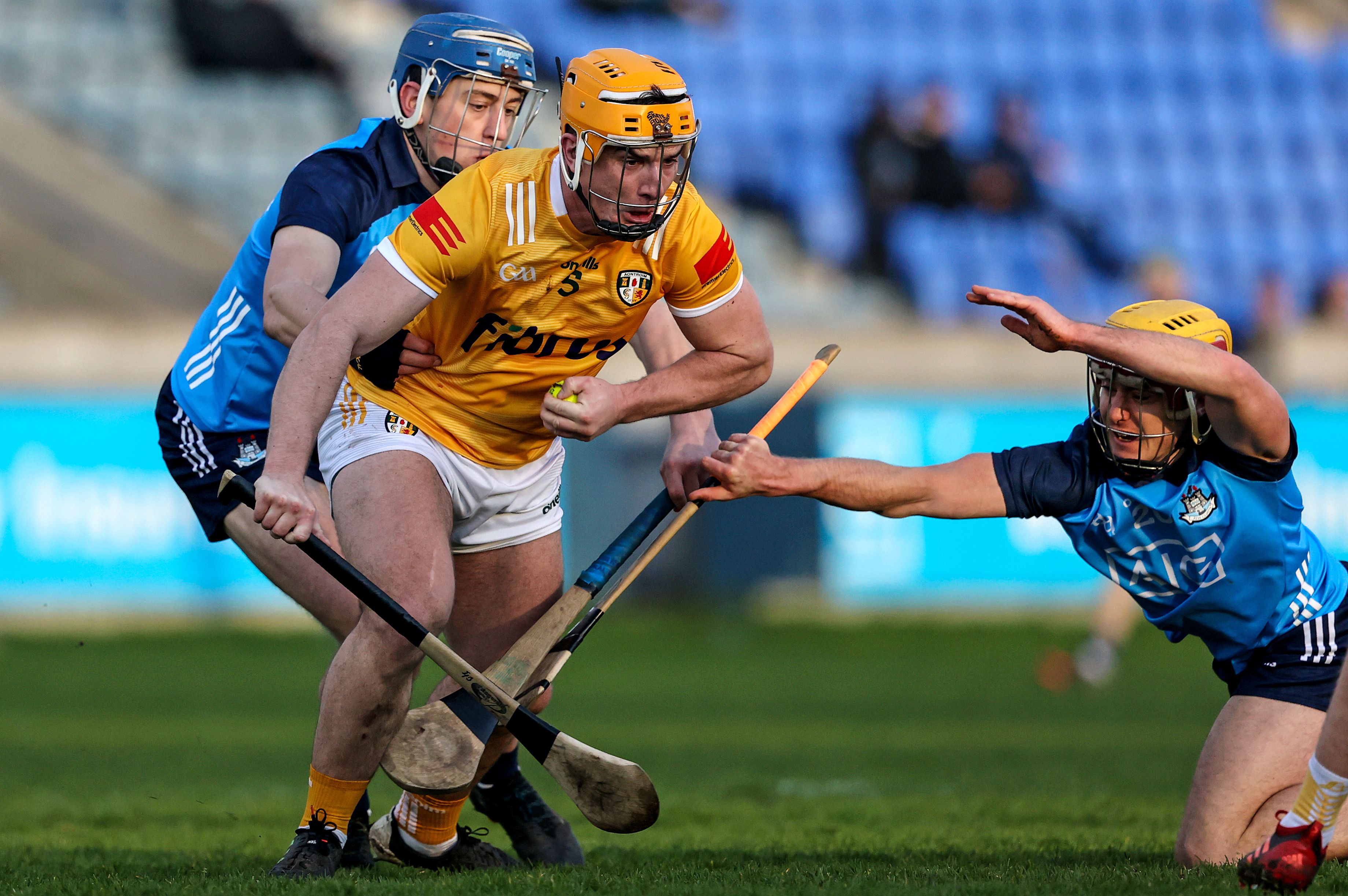 Michael Bradley is tackled by Paul Crummey and Andrew Jamieson-Murphy at Parnell Park on Saturday 