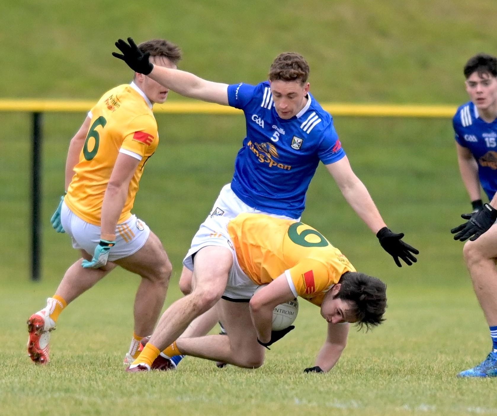 Patrick Finnegan goes down under the challenge of Ciarán Brady in Portglenone on Sunday 