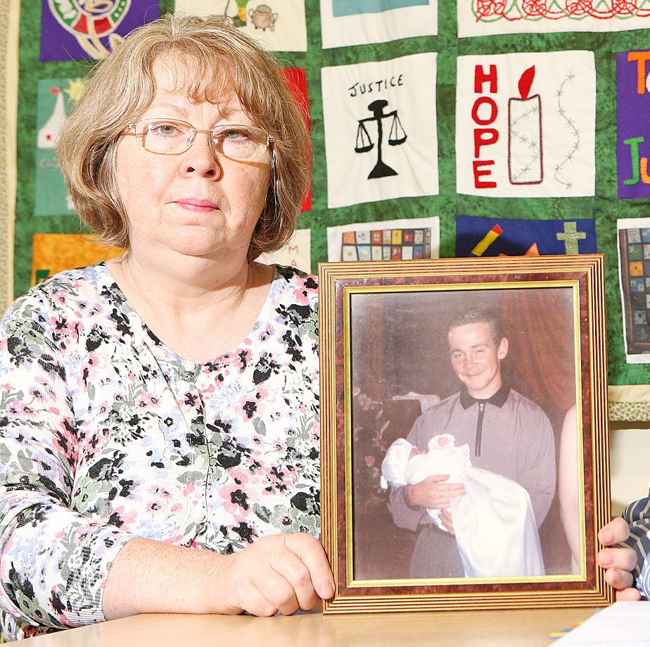 \'INSENSITIVE\': Marian Walsh holds a photo of her son Damien who was murdered by the UDA in 1993