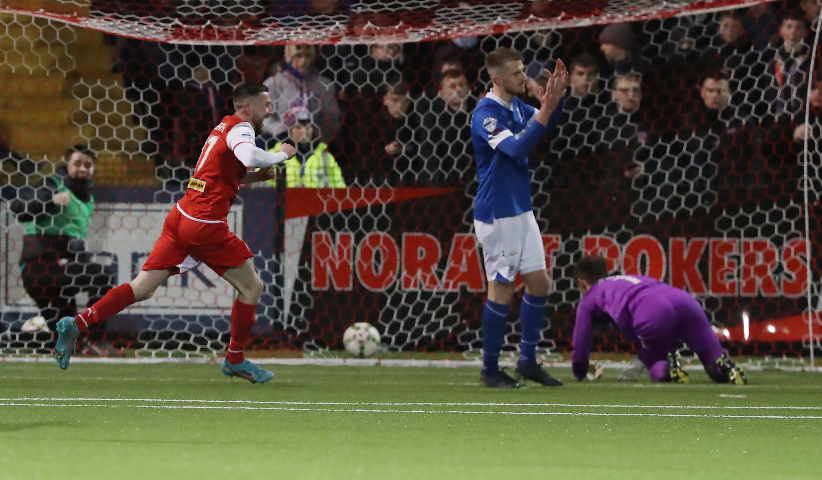 Ronan Doherty wheels away after scoring the only goal of the game at Solitude on Tuesday 