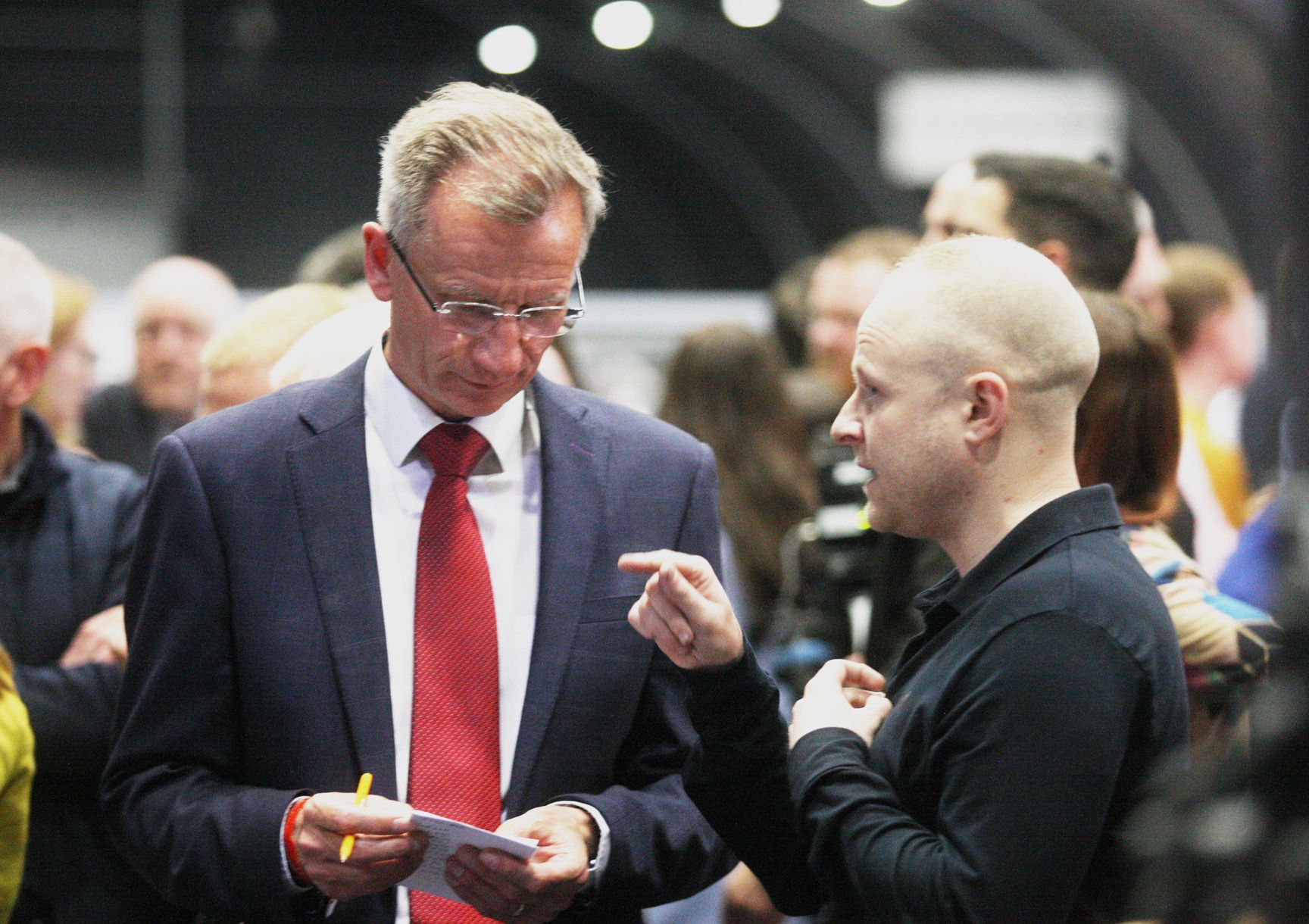 ADVICE: Blogger Jamie Bryson speaking with the soon to be elected DUP MLA Brian Kingston at the Assembly election count in the Titanic Exhibition Centre back in May