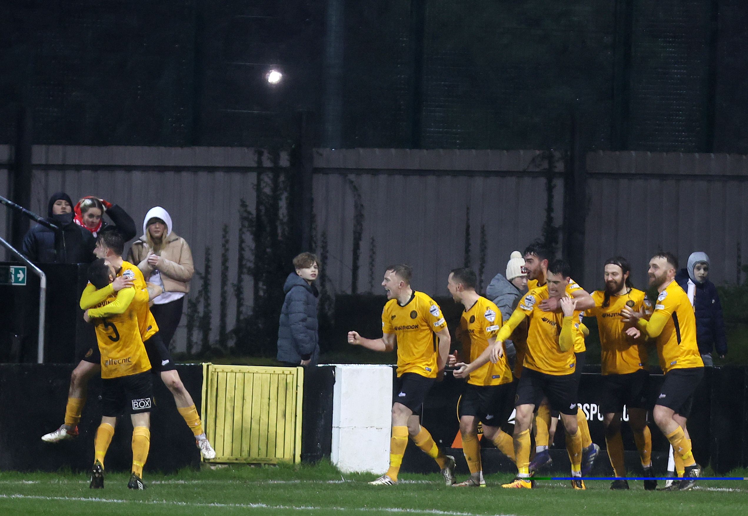 Carrick Rangers players celebrate as Lloyd Anderson nets a last-minute equaliser 