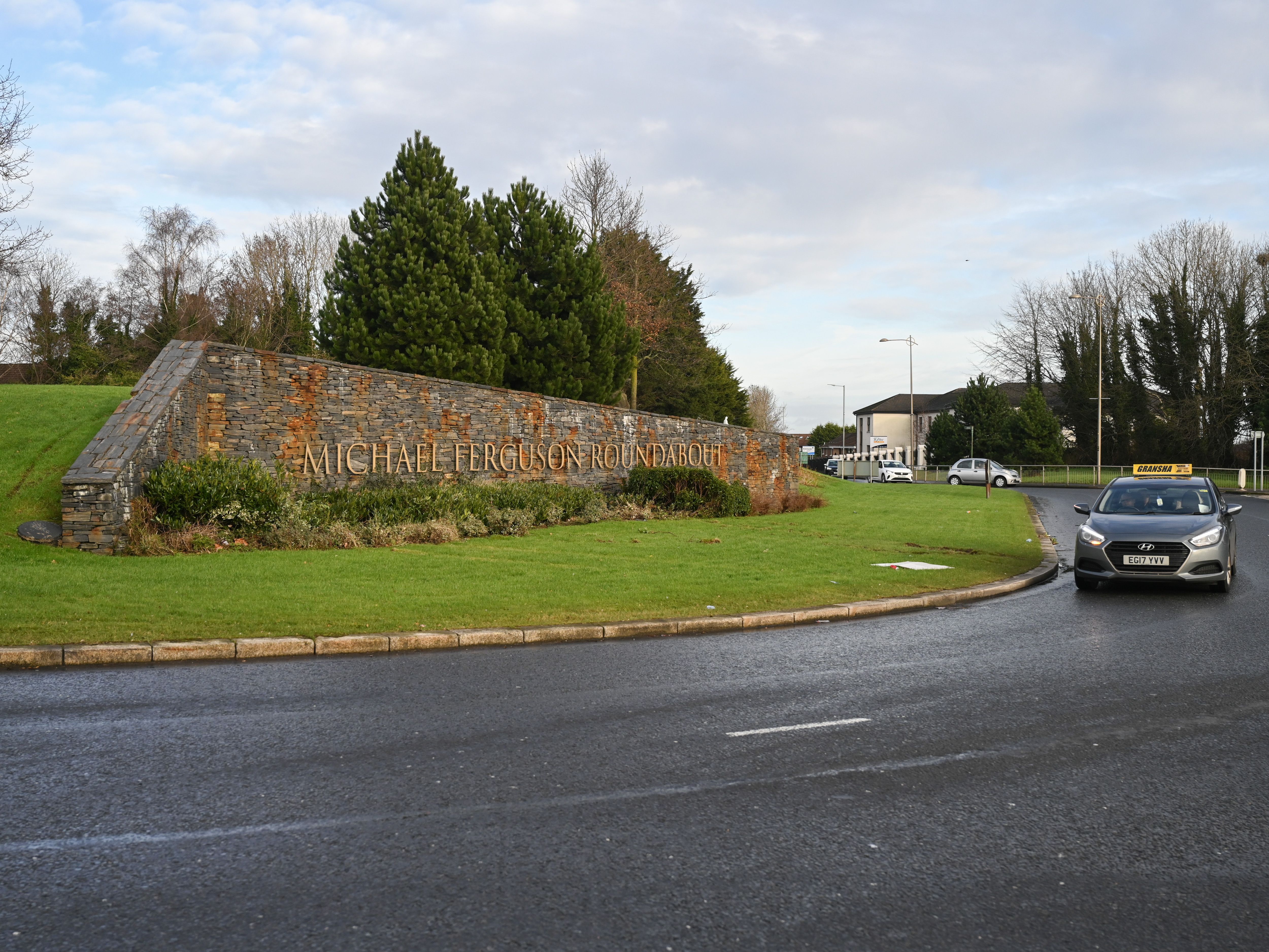 CHARGED: A man was forced into the back of a blue Citroen Berlingo van by two men in the Upper Dunmurry Lane area on Saturday before it was driven away from the Michael Ferguson roundabout