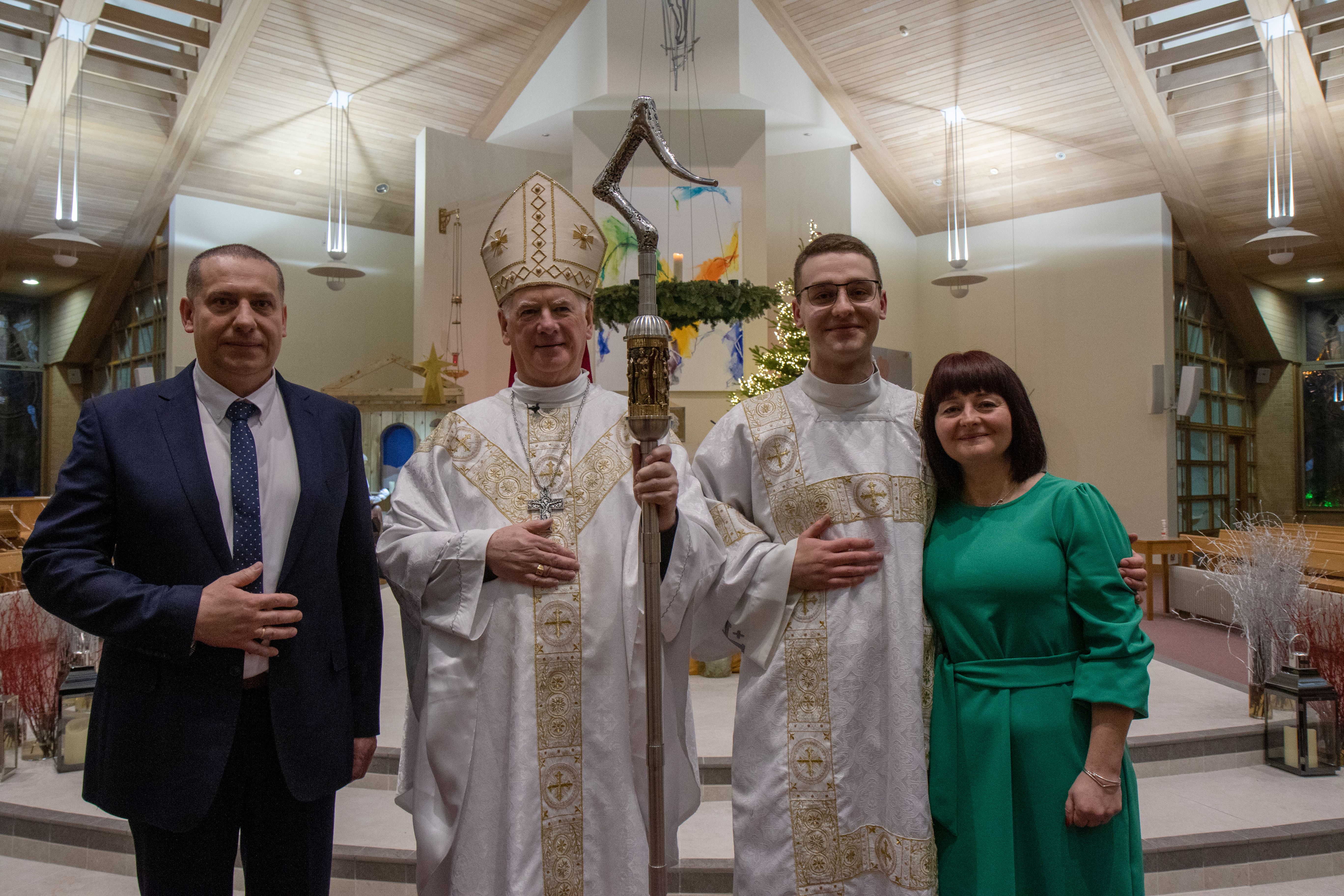 SPECIAL MOMENT: Rev David Aksenczuk with his parents Ola & Jarek and Archbishop Noel Treanor at his Ordination to the Diaconate in The Church of the Immaculate Heart of Mary, Carryduff