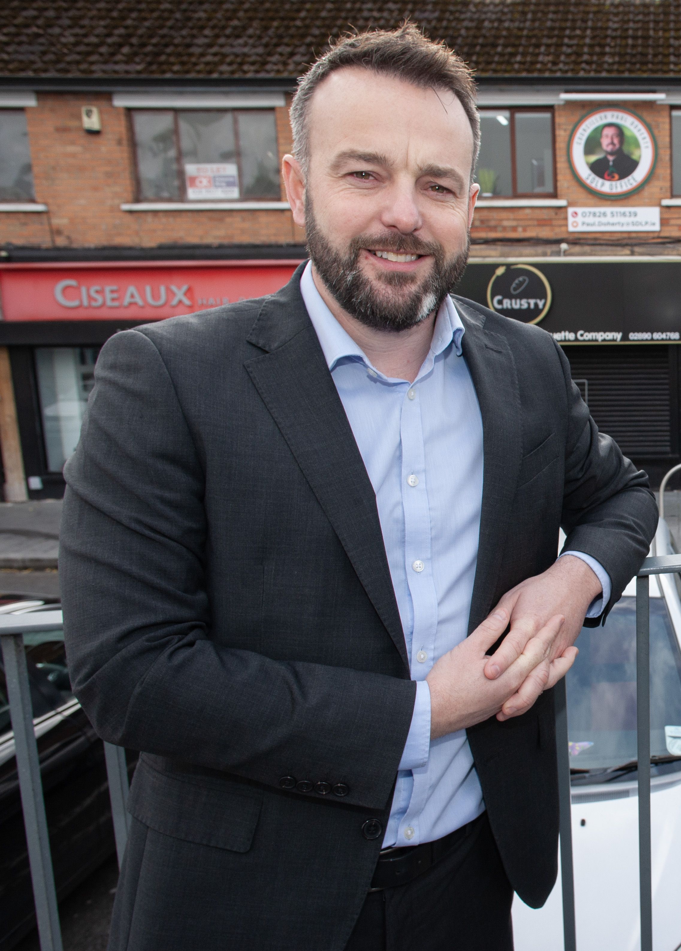 STANDING FIRM: Colum Eastwood outside the new SDLP office in Andersonstown