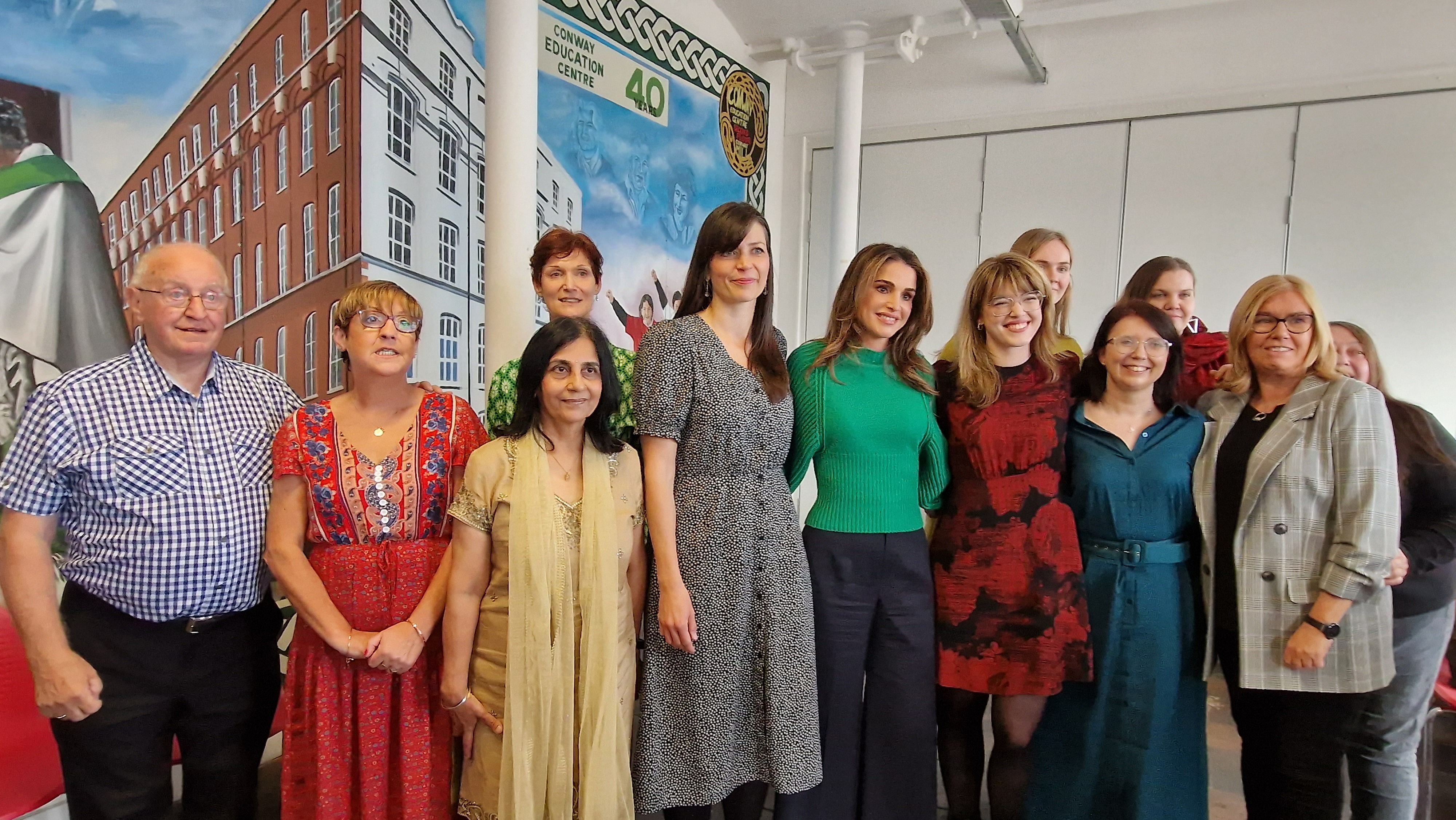 ROYAL VISIT: Queen Rania of Jordan (centre) with members of Conway Education Centre, ArtsEkta and refugees living in Belfast