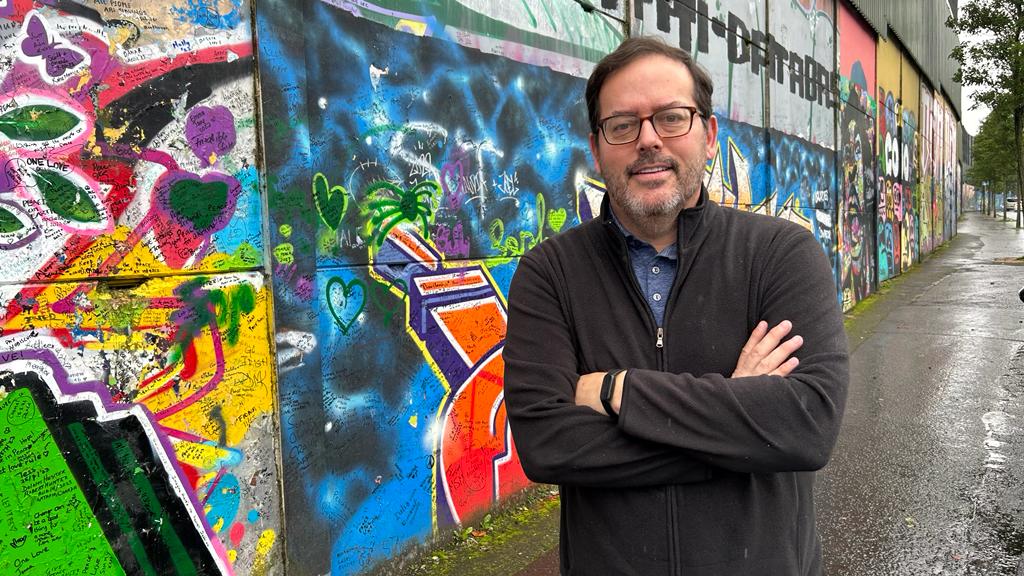 BUILDING BLOCKS: Brian Moran at the peacewall separating the nationalist Clonard from the unionist Shankill in West Belfast