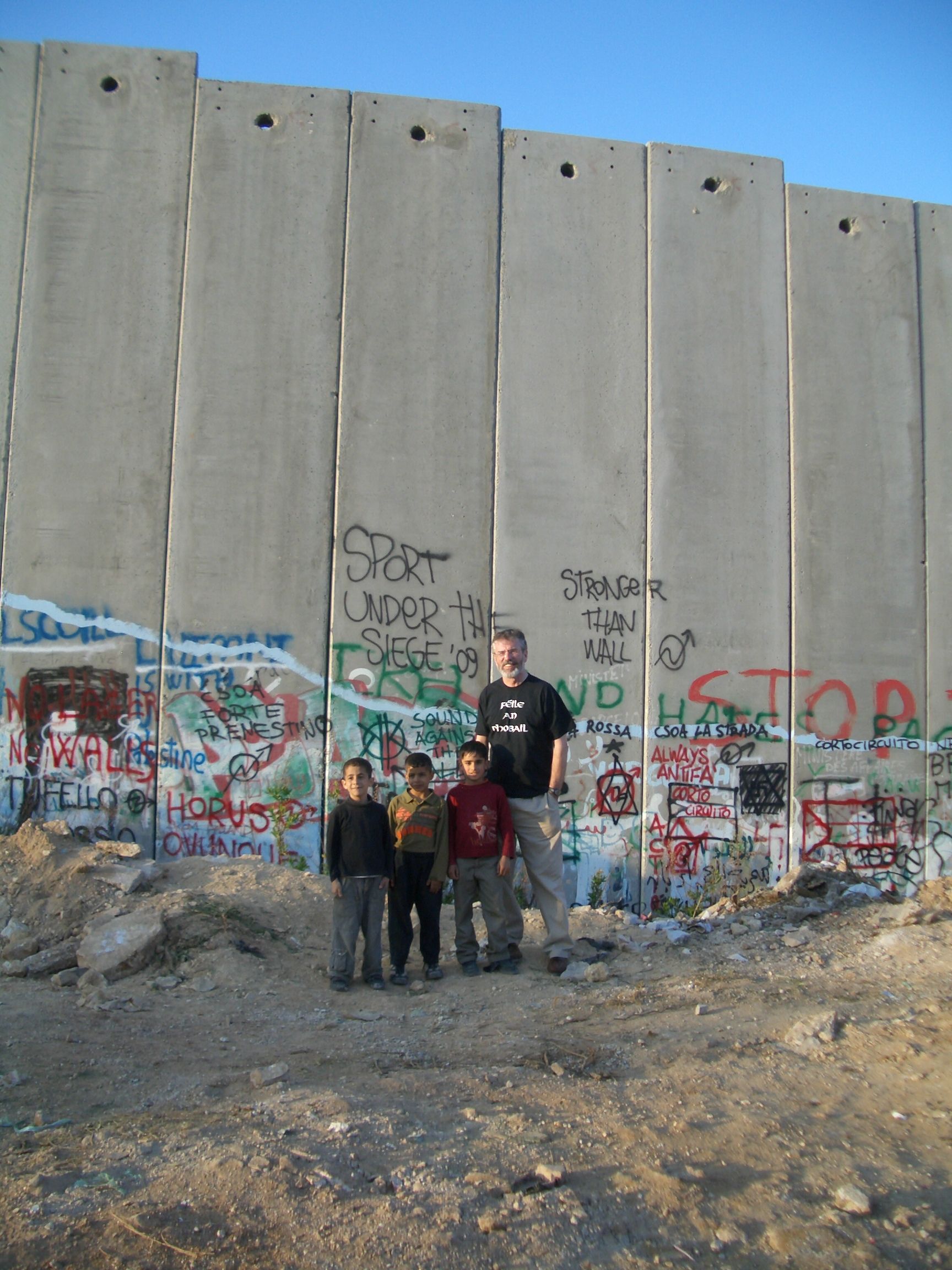 APARTHEID: GERRY Adams with Palestinian children at the separation wall in Bethlehem in 2009