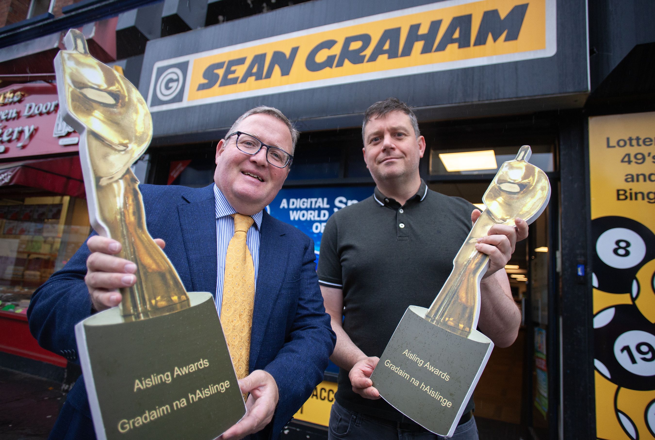 Brian Graham from Sean Graham Bookmakers and Belfast Media Group\'s Sports Editor, David Mohan, as calling for nominations for this year\'s Aisling Sports Award