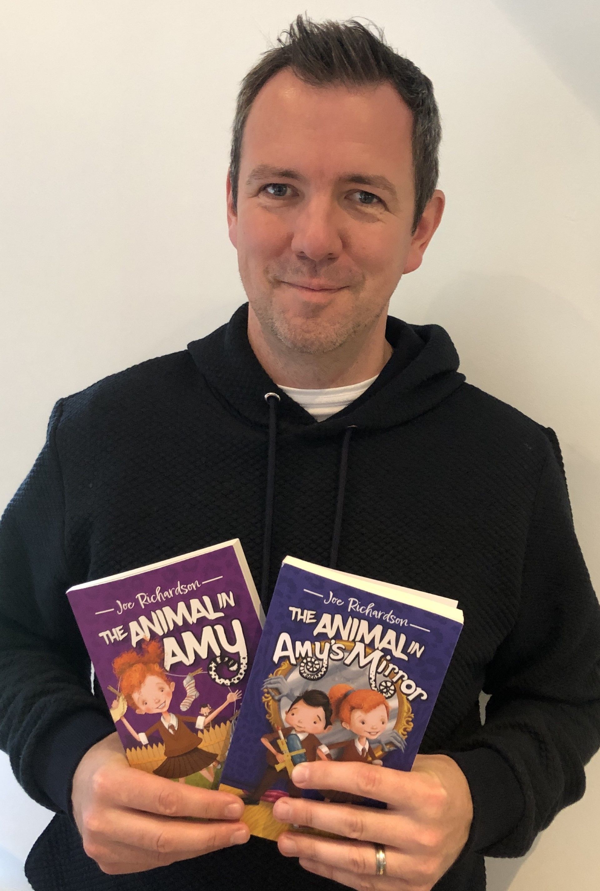 AT THE DOUBLE: Teacher Joe Richardson with both of his \'Animal in Amy\' books