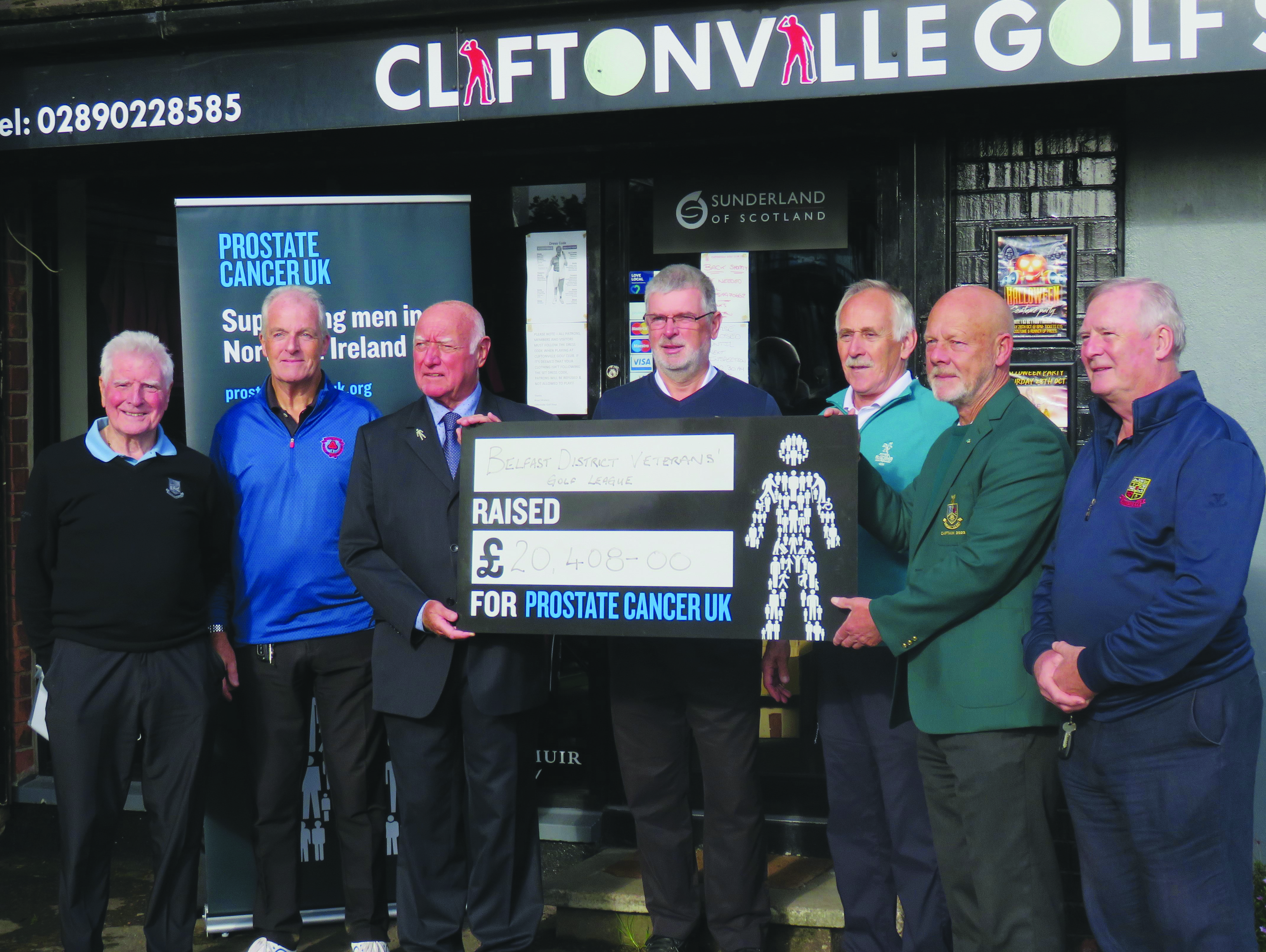 League members hand over a cheque for £20,408 to Prostate Cancer UK