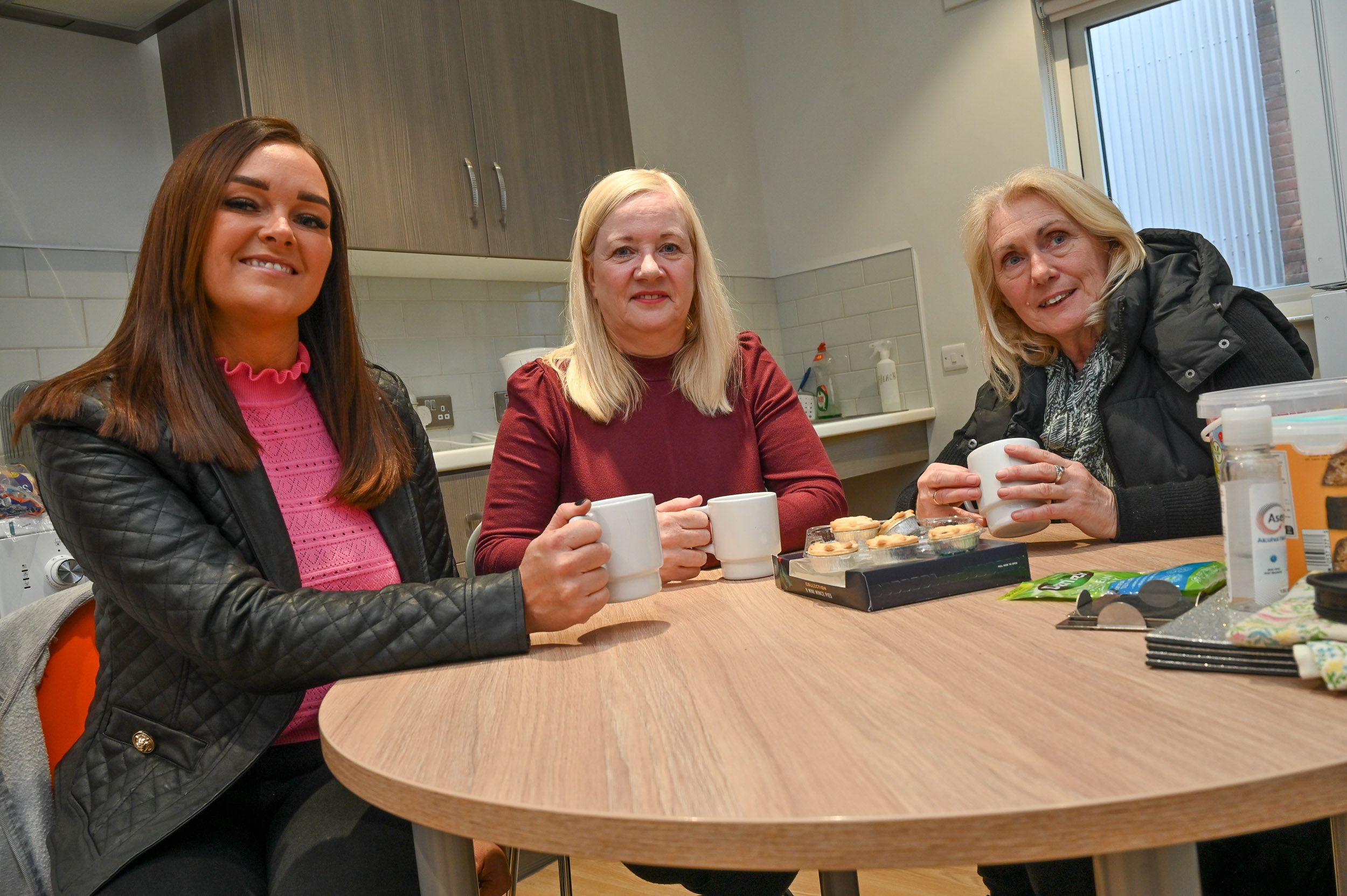 SUPPORT: Grace Family Centre Director Sally Smyth with Paula Ryan from the Housing Executive and service user Rosemary Stephenson