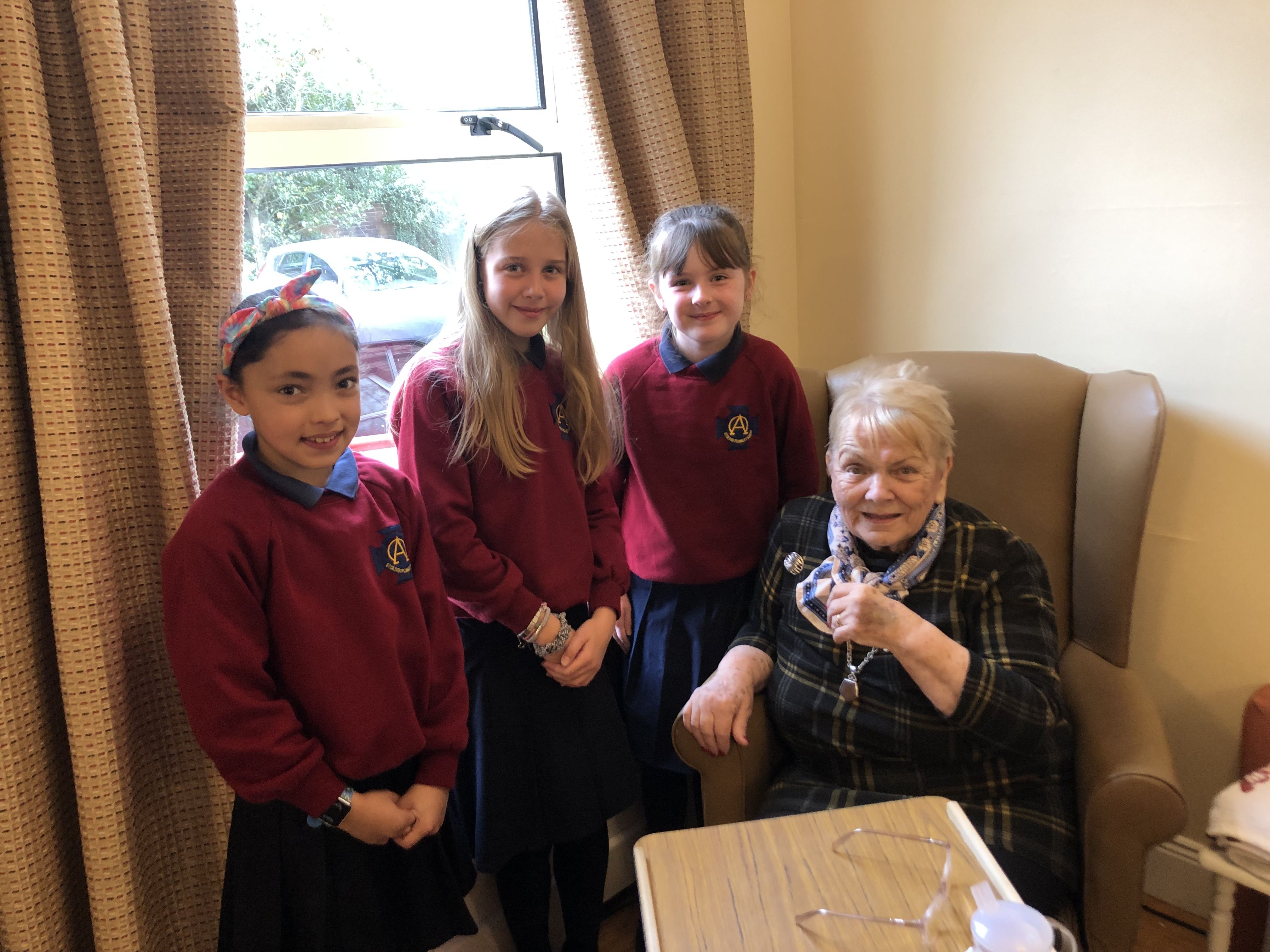 SING-A-LONG: Pupils from St Oliver Plunkett Primary School sang old Belfast street songs for residents of Fruithill Nursing home