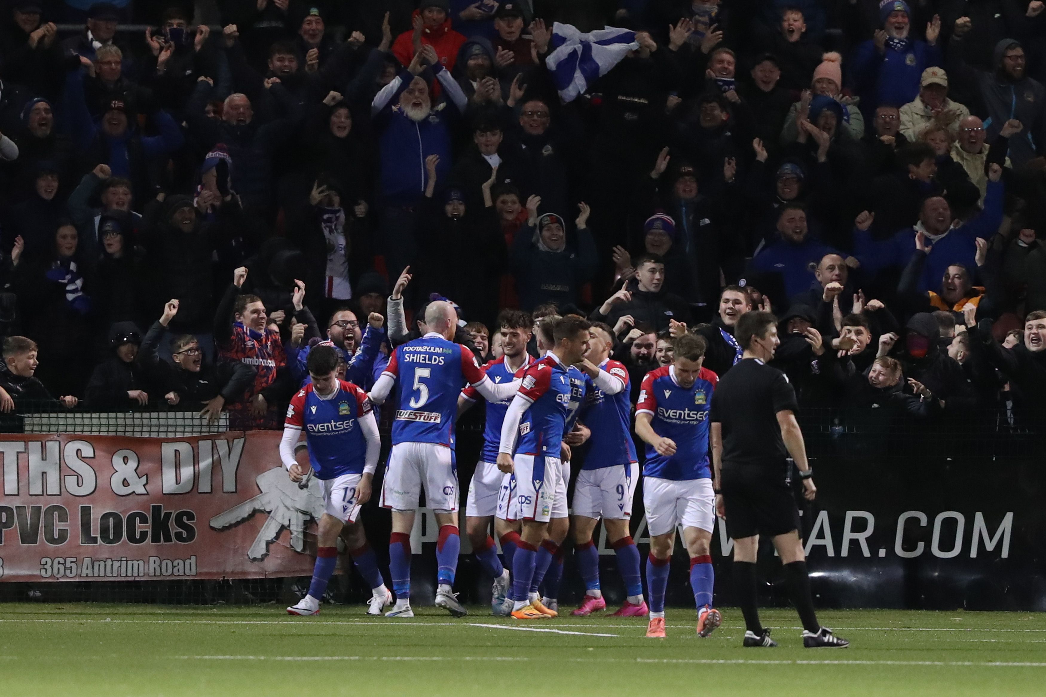 Chris McKee is mobbed after scoring the only goal of the game on Friday