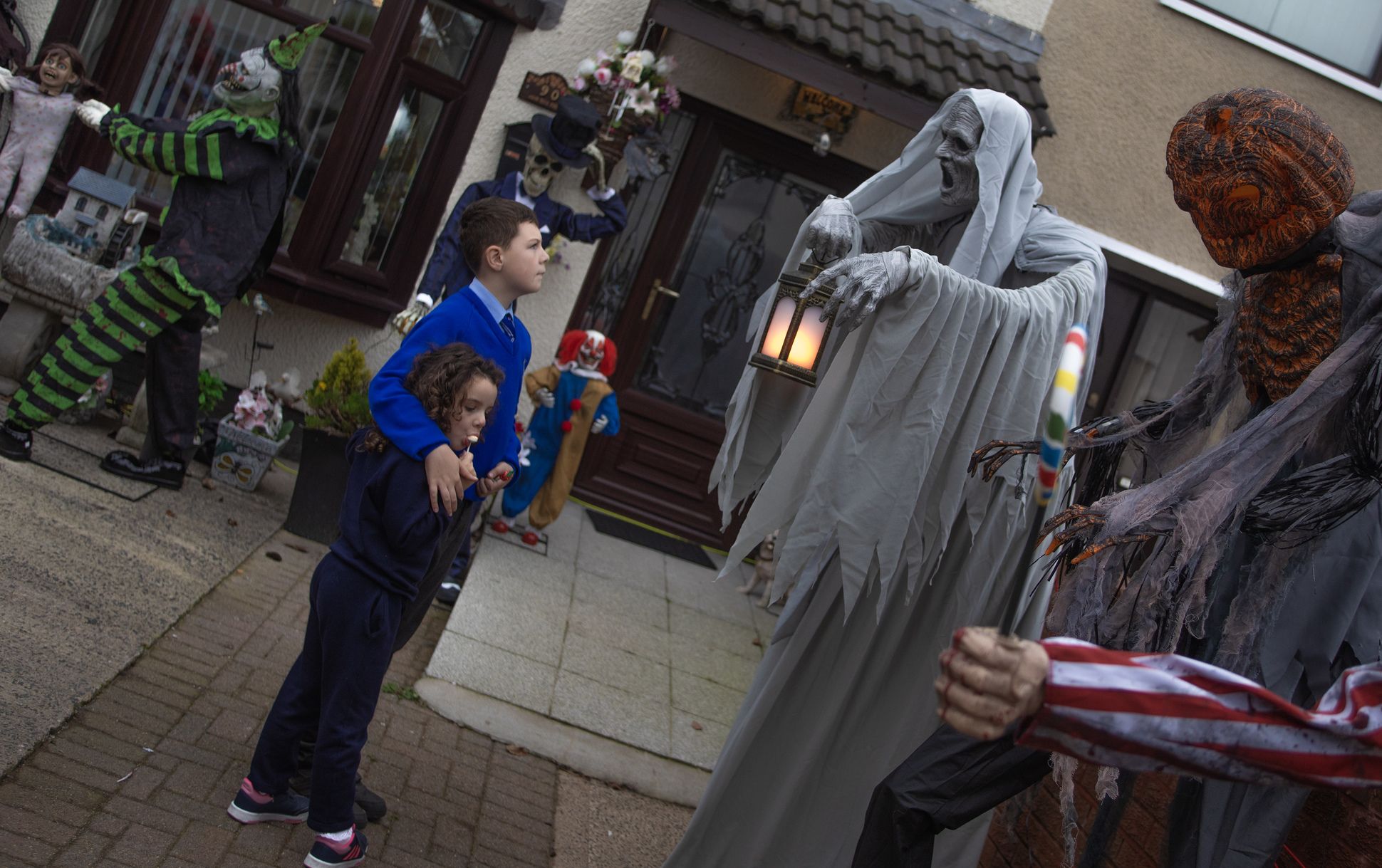 SPOOKY: Children check out the spooky statues in Lenadoon