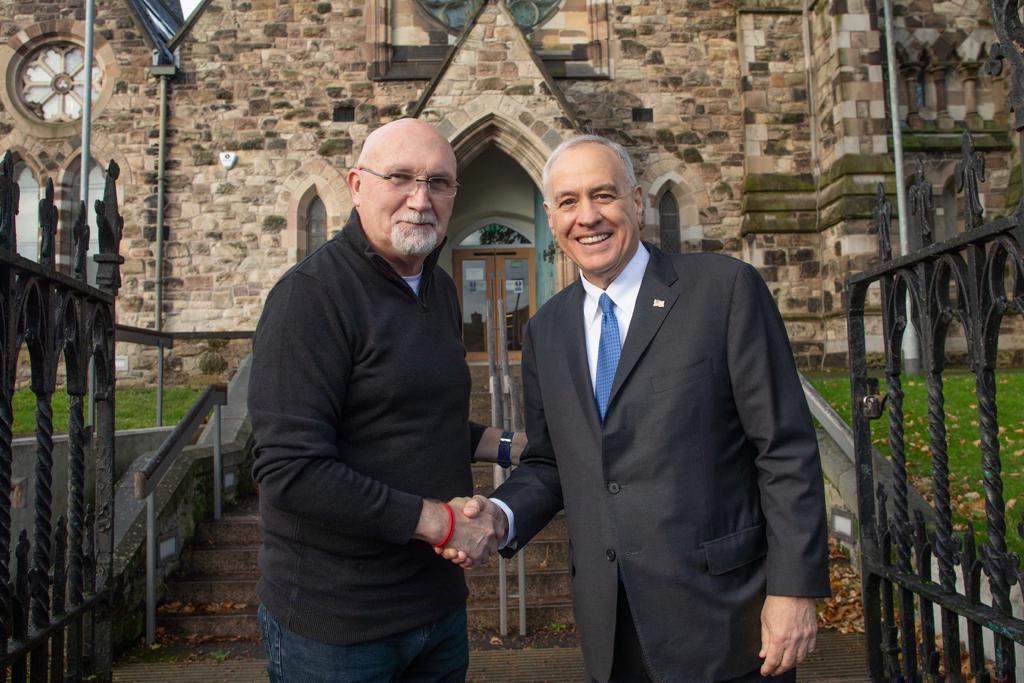 INVESTMENT PLEDGE: Comptroller Tom DiNapoli of New York State is welcomed to The Duncairn arts centre in North Belfast by director the Rev Bill Shaw. 