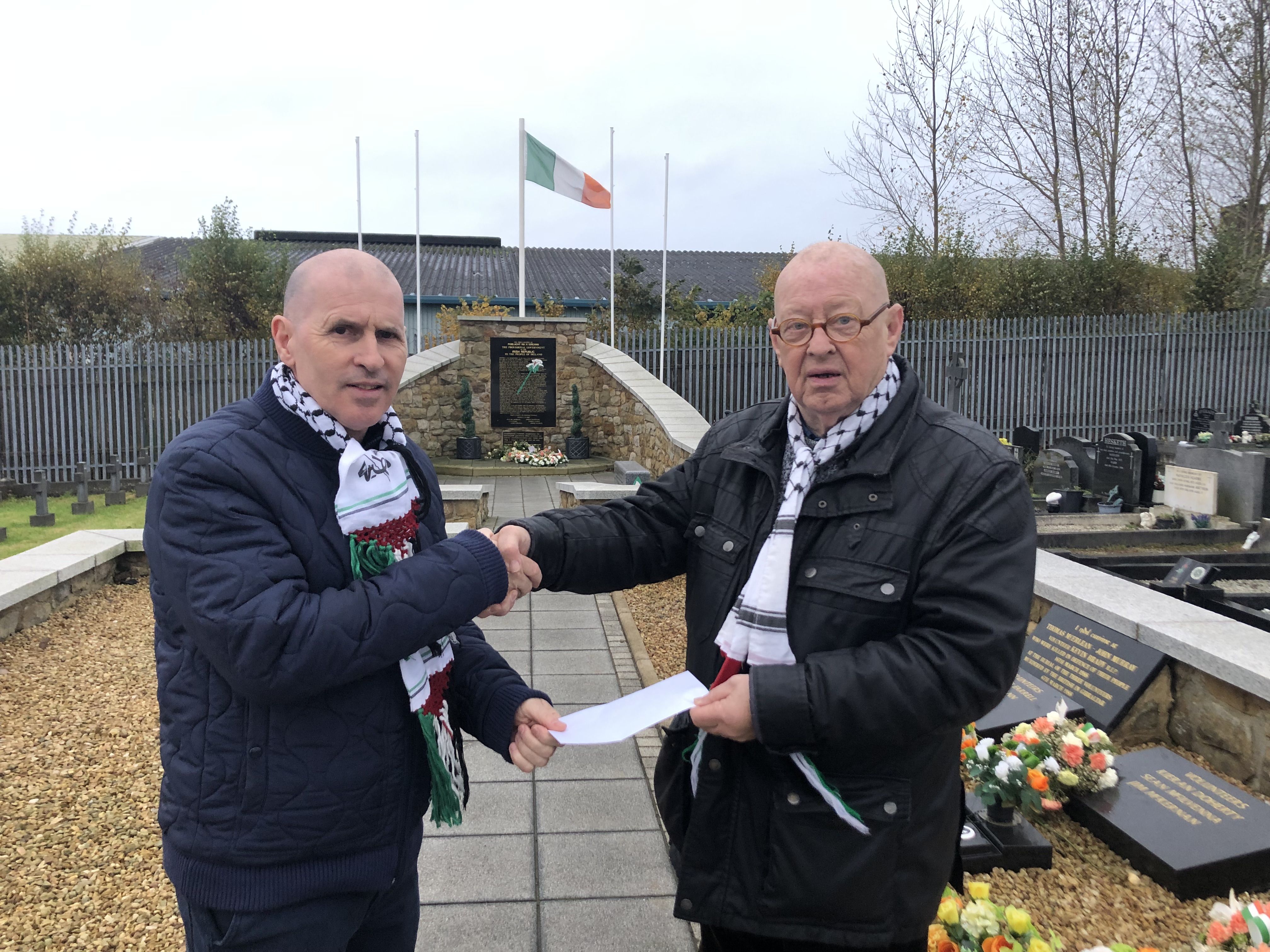 GAZA: Dominic Adams from Cairde Robert Laverty presents the money raised to Joe Austin of the National Graves Association