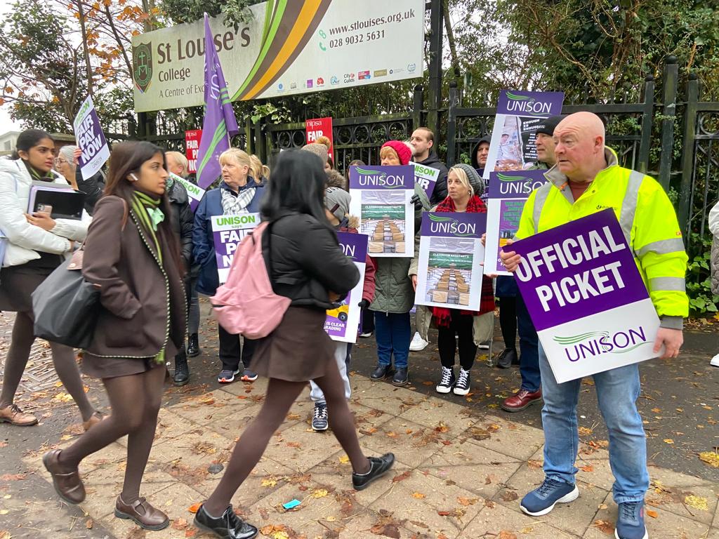 ON STRIKE: Staff outside St Louise\'s on the Falls Road this morning