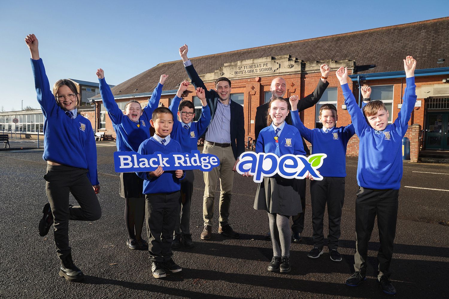 Apex\'s Director of Development, and Terry Rodgers, Principal of St Teresa\'s PS, with pupils Brianna Duffy, Holly Cameron, Alvin Shi, Eoin McAleavey, Megan Peel, Manuel Kennedy and Cohen Black