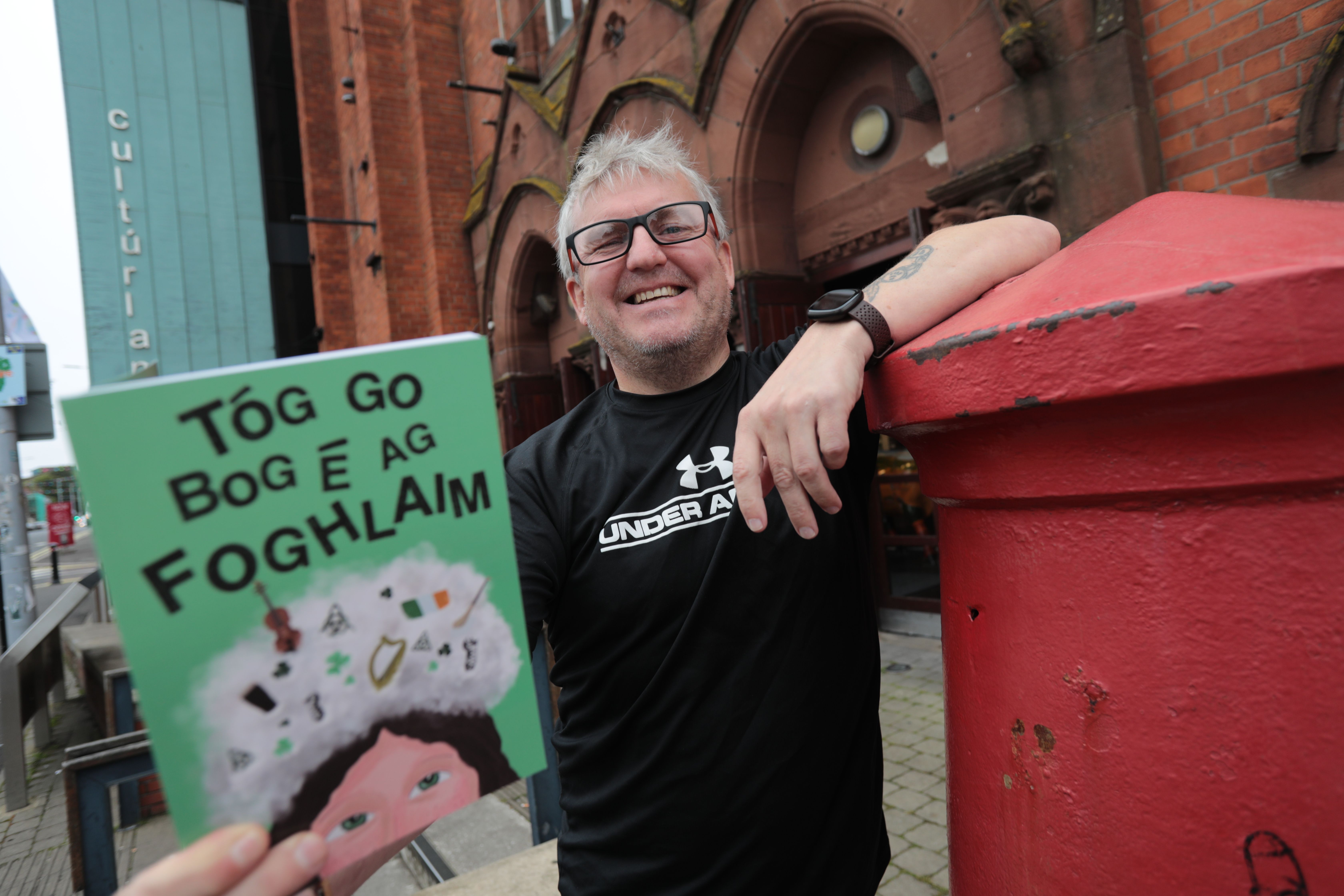 EASY LEARNING: Gearóid Ó Lochlainn with his book \'Tóg Go Bog É Ag Foghlaim\' outside the Cultúrlann in Belfast