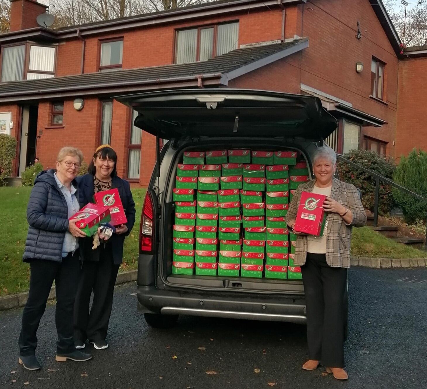 SEASONAL GESTURE: St Oliver Plunkett parish members with a van loaded with Christmas gifts