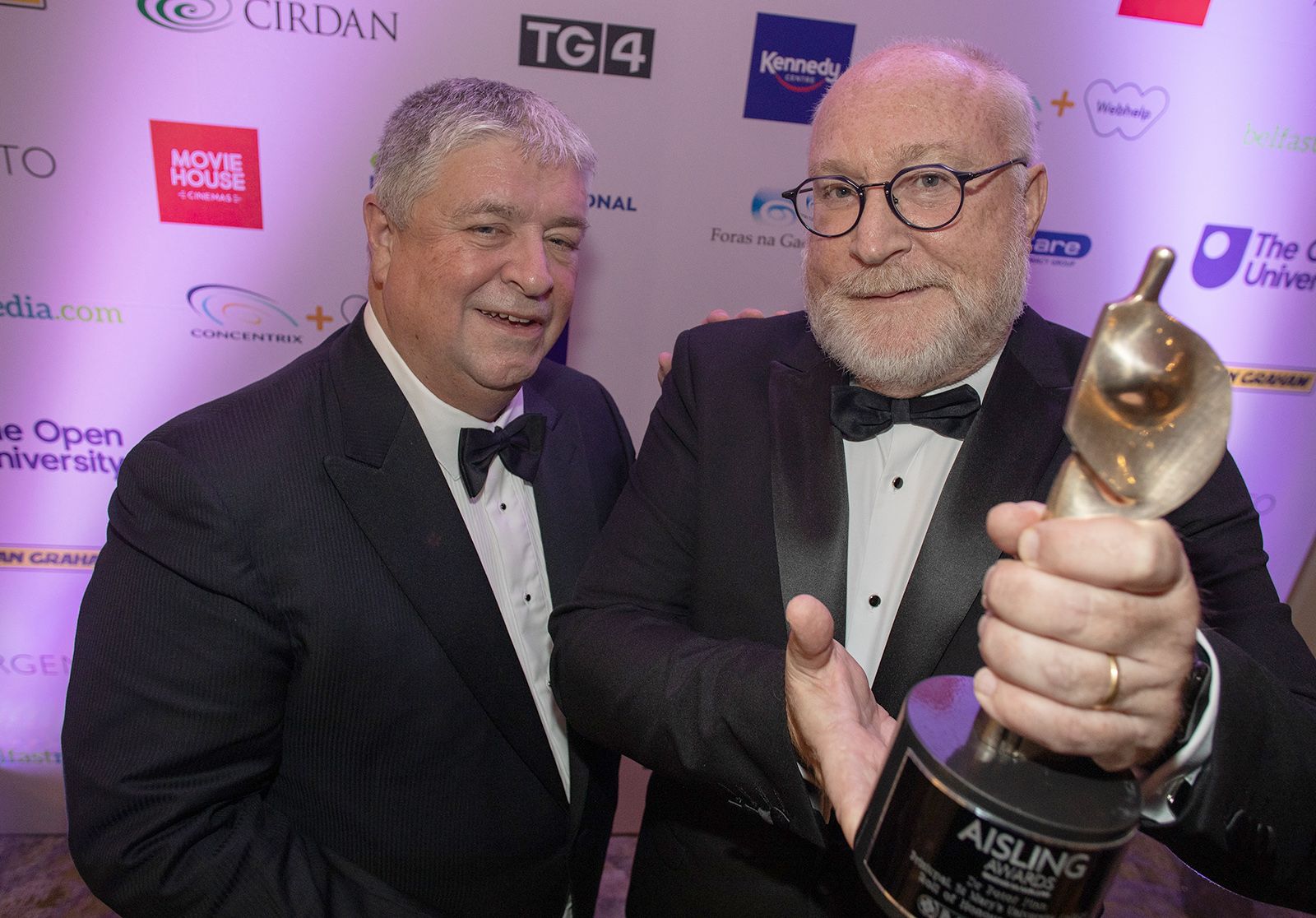 HONOUR: Peter Finn, Principal of St Mary’s University College, is presented with his award by Michael Guerin from sponsors Medicare