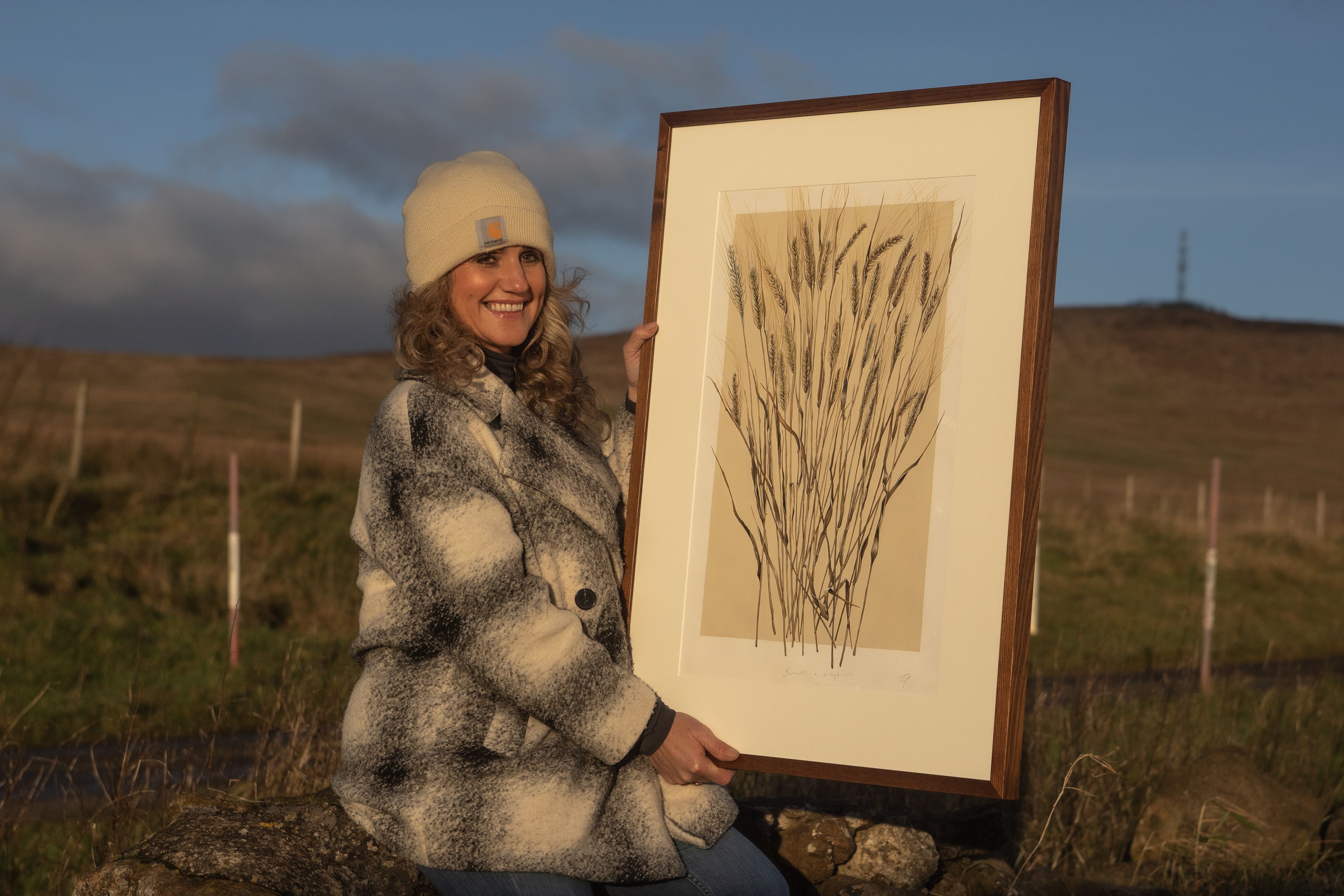 ART: Artist Eimear Maguire up on the Belfast Hills with the print she created for Bushmills Whiskey