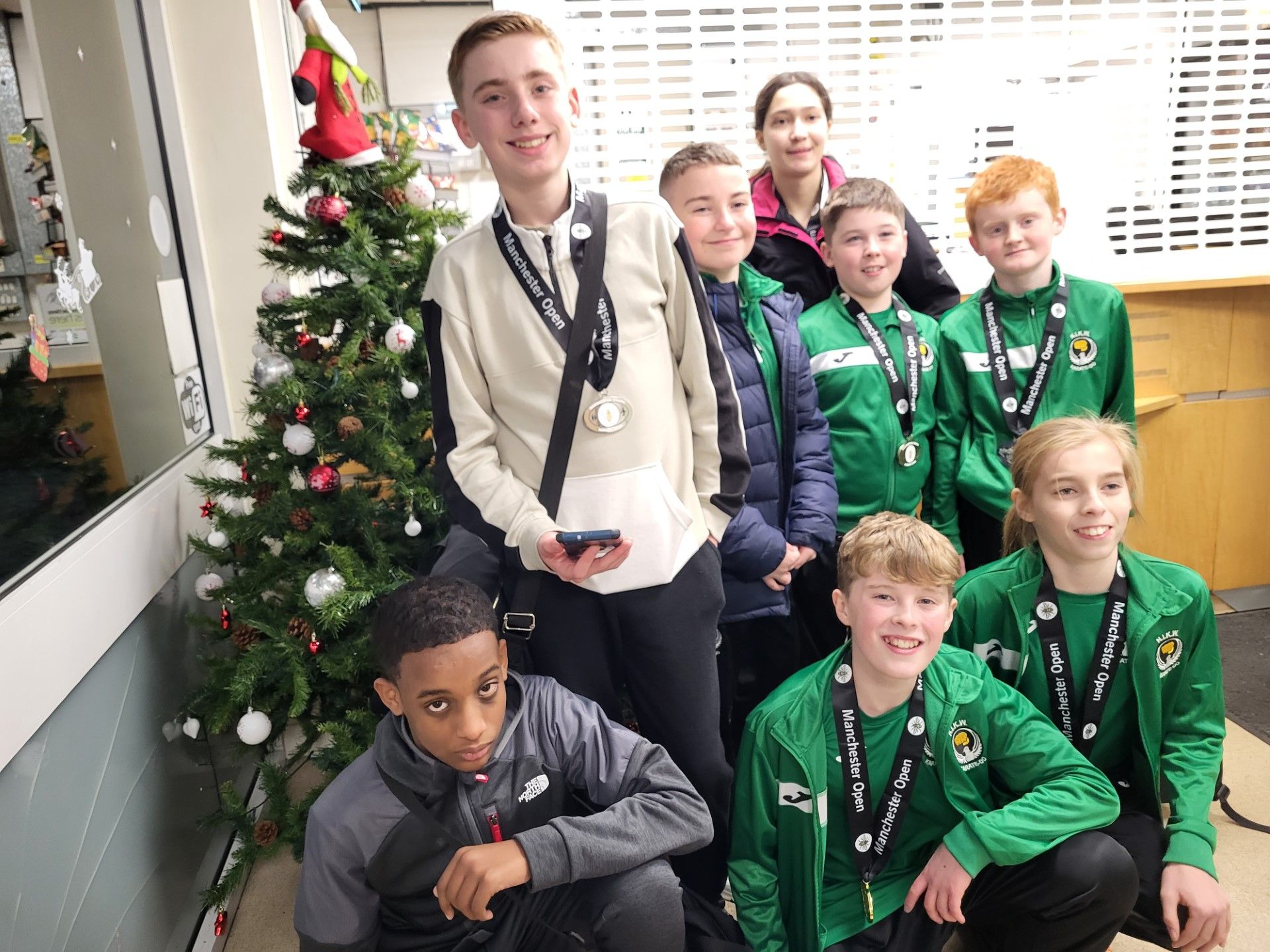 The Northern Ireland youth karate squad show off their medals at the George Carnell Leisure Centre in Manchester