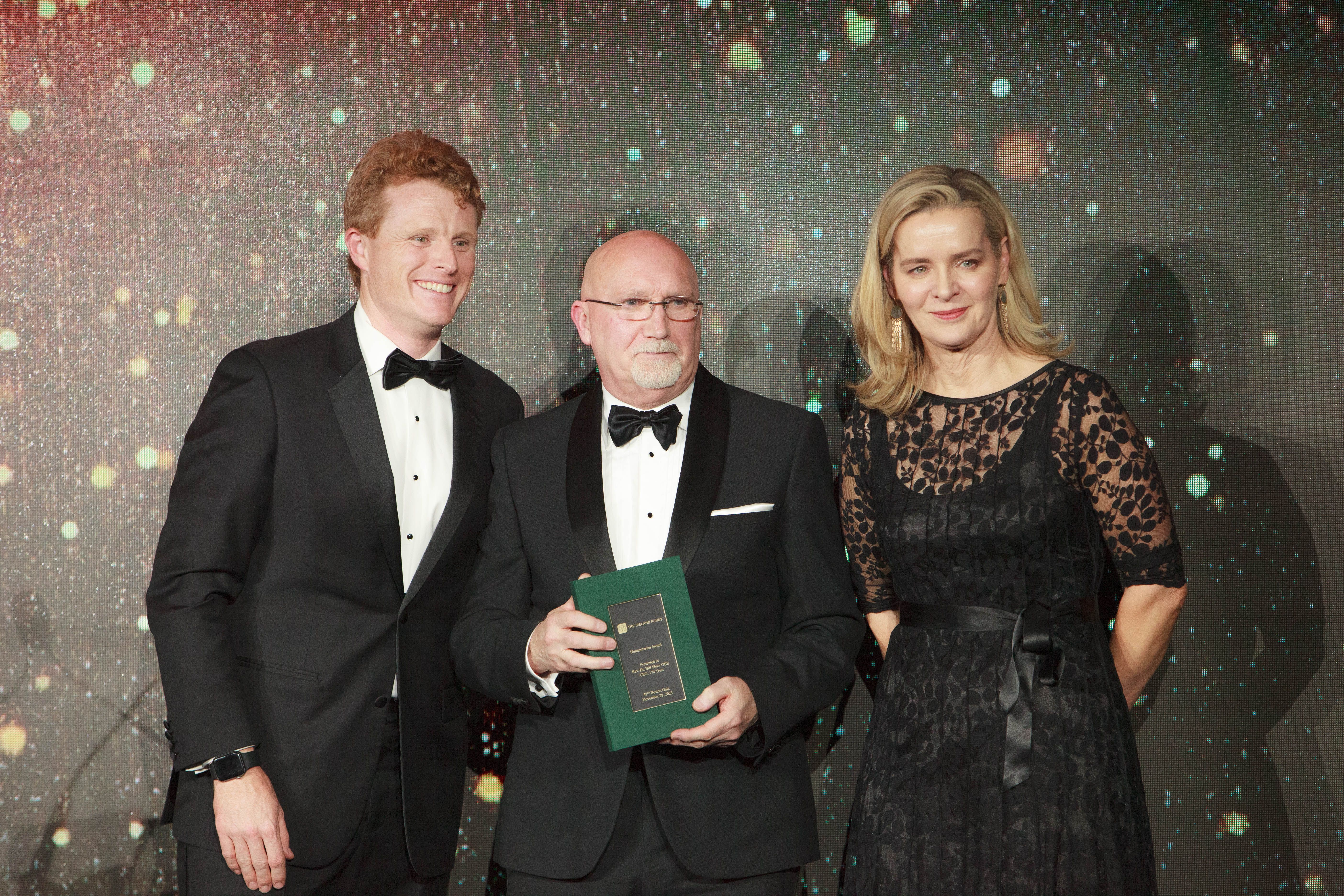AWARD: Rev. Bill Shaw, CEO of the 174 Trust receives The Ireland Funds 2023 Humanitarian Award from Joe Kennedy III, U.S. Special Envoy to Northern Ireland for Economic Affairs and Caitriona Fottrell, President and CEO of The Ireland Funds.   