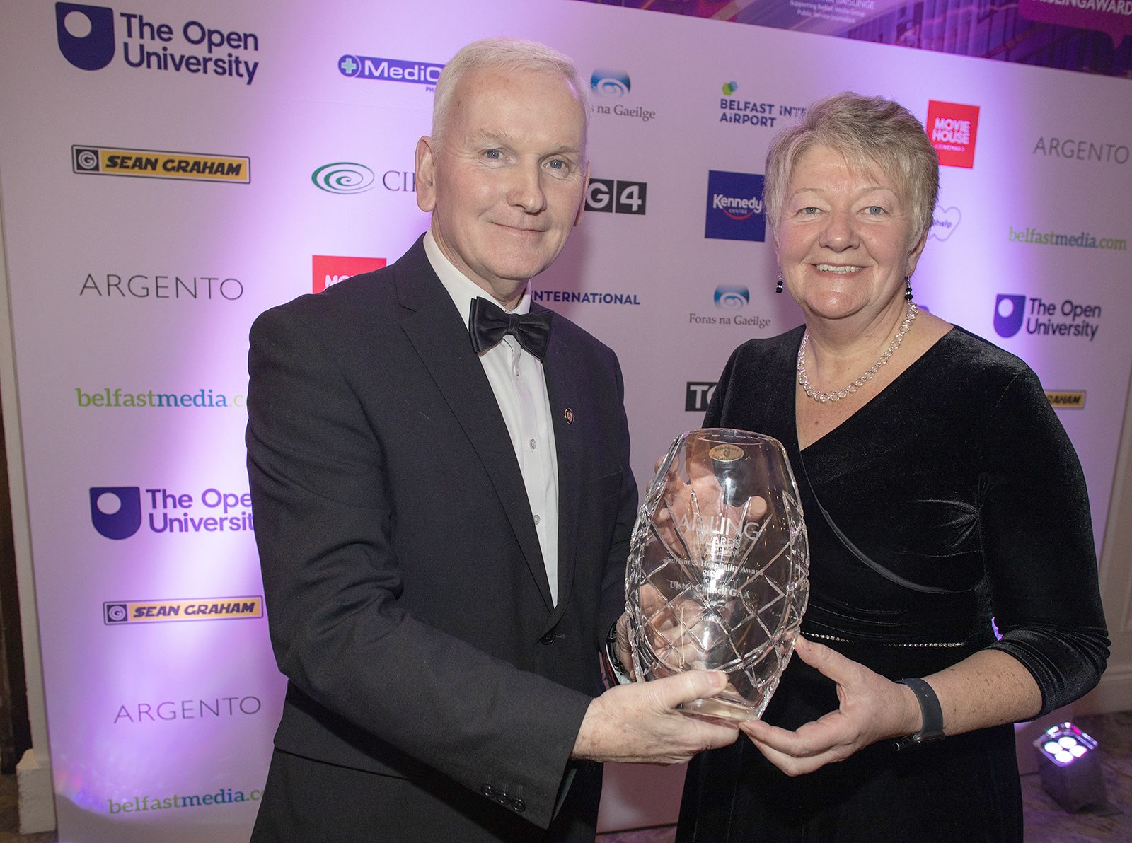 HOSPITALITY AND TOURISM AWARD: Ellvena Graham (Chair Tourism NI) presents the award to Michael Geoghegan (Vice-President Ulster GAA).