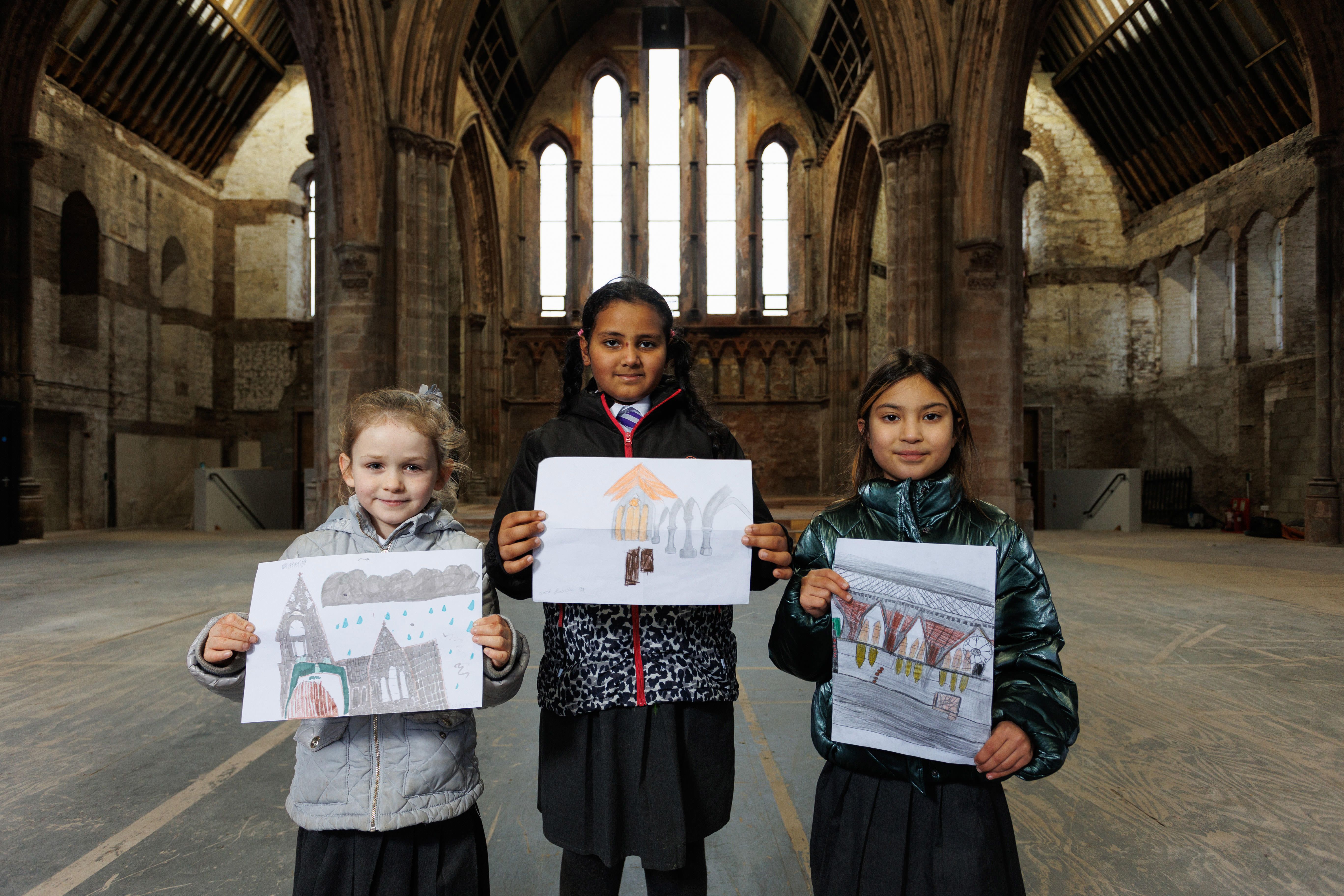 SEASON\'S GREETINGS: Courtney Kelly, Ward Basultan and Nuriya Djamshedovna from St Patrick’s Primary School won a competition to design an image to promote the event