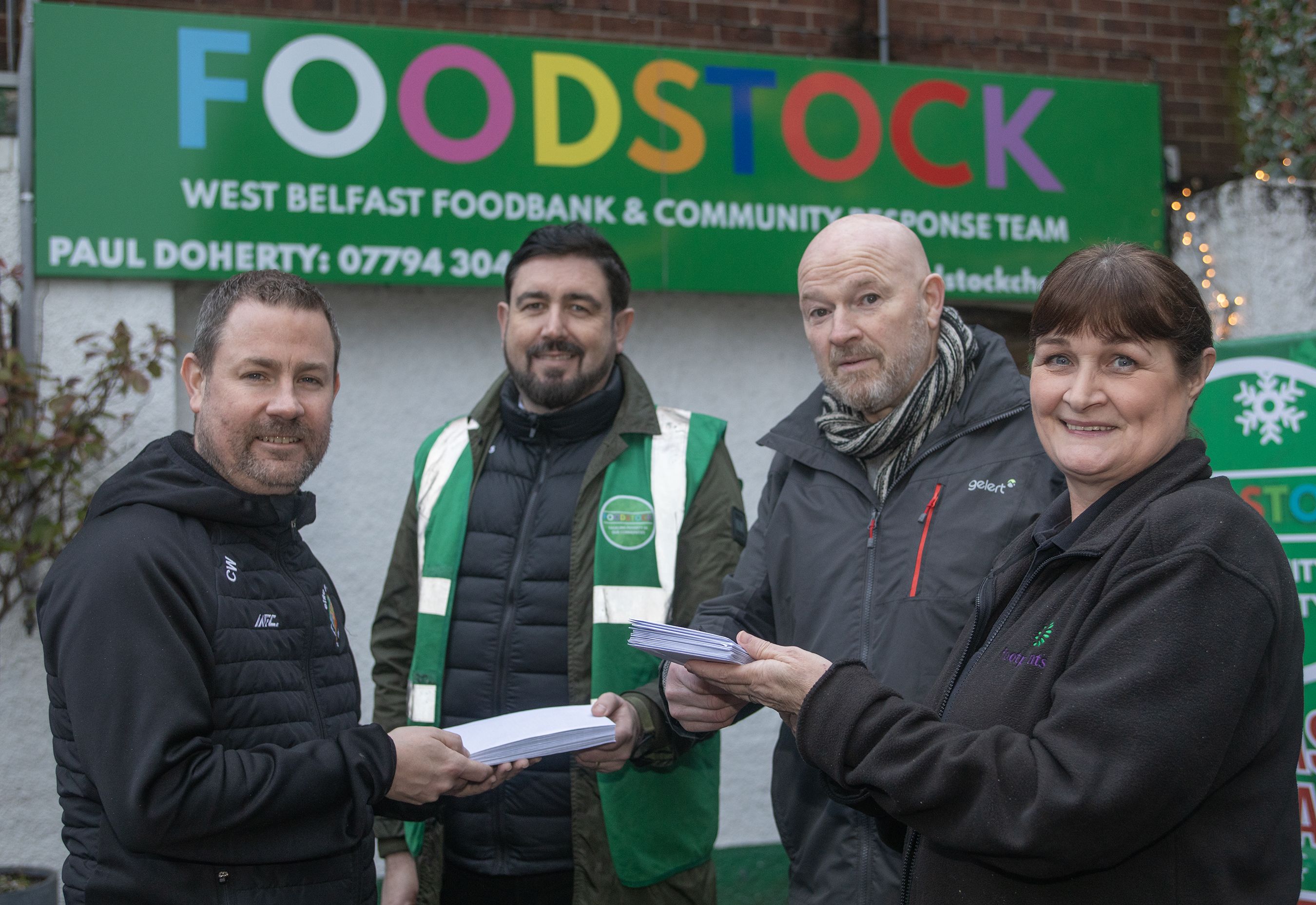 DONATION: Chris Ward and Joe McGratton from Éire Go Brách CSC with Paul Doherty (Foodstock) and Eileen Wilson (Footprint Women\'s Centre)
