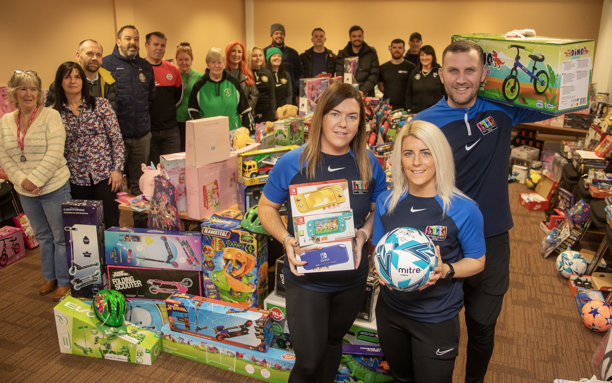 TOYS: Glen Parent Youth Group members Robert Sands and Karen Nugent with some of those who helped with Lenadoon Toy Appea
