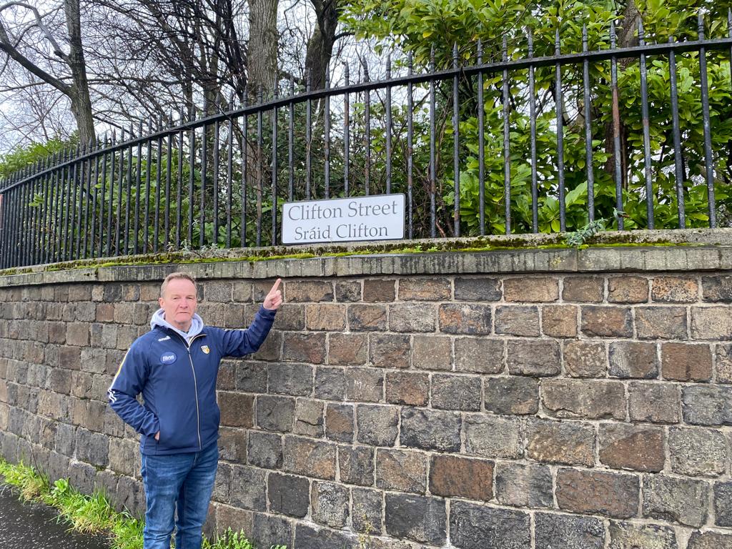 WELCOME: Sinn Féin councillor JJ Magee at the new bilingual street signage in Clifton Street