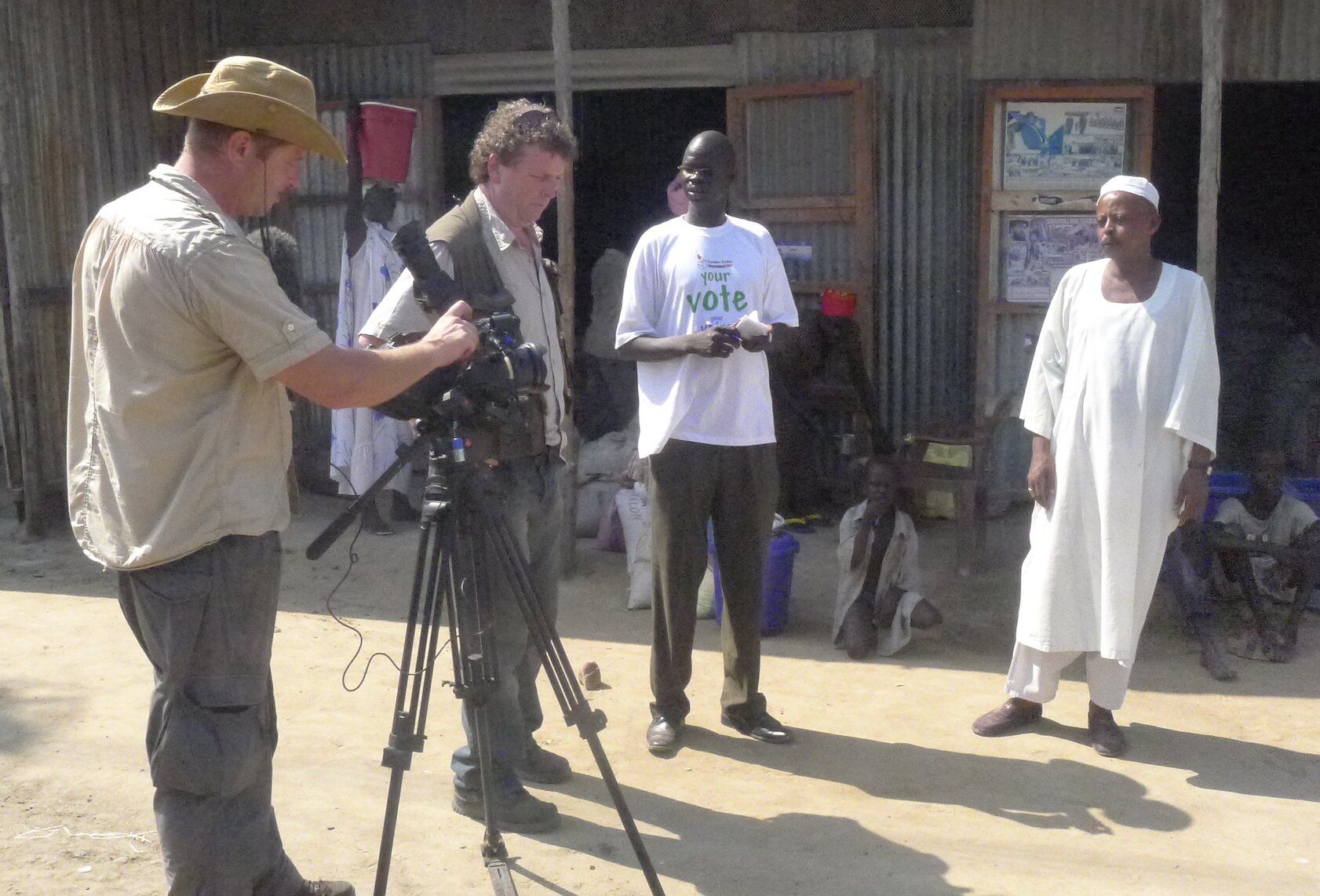 SOUTH SUDAN: Jamie Doran and cameraman with locals while shooting in South Sudan