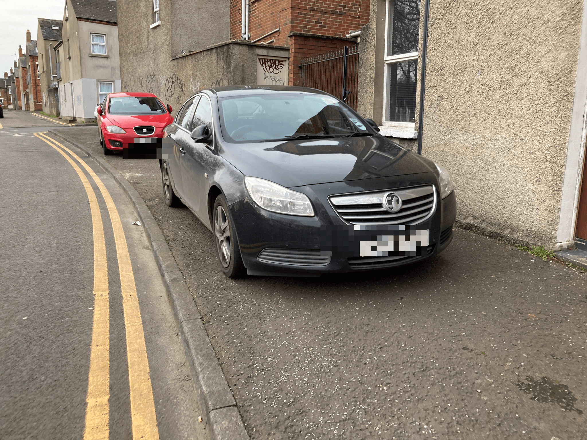 NO WAY THROUGH: Drivers in the Holyland have been parking on the pavement and ignoring double yellow lines 