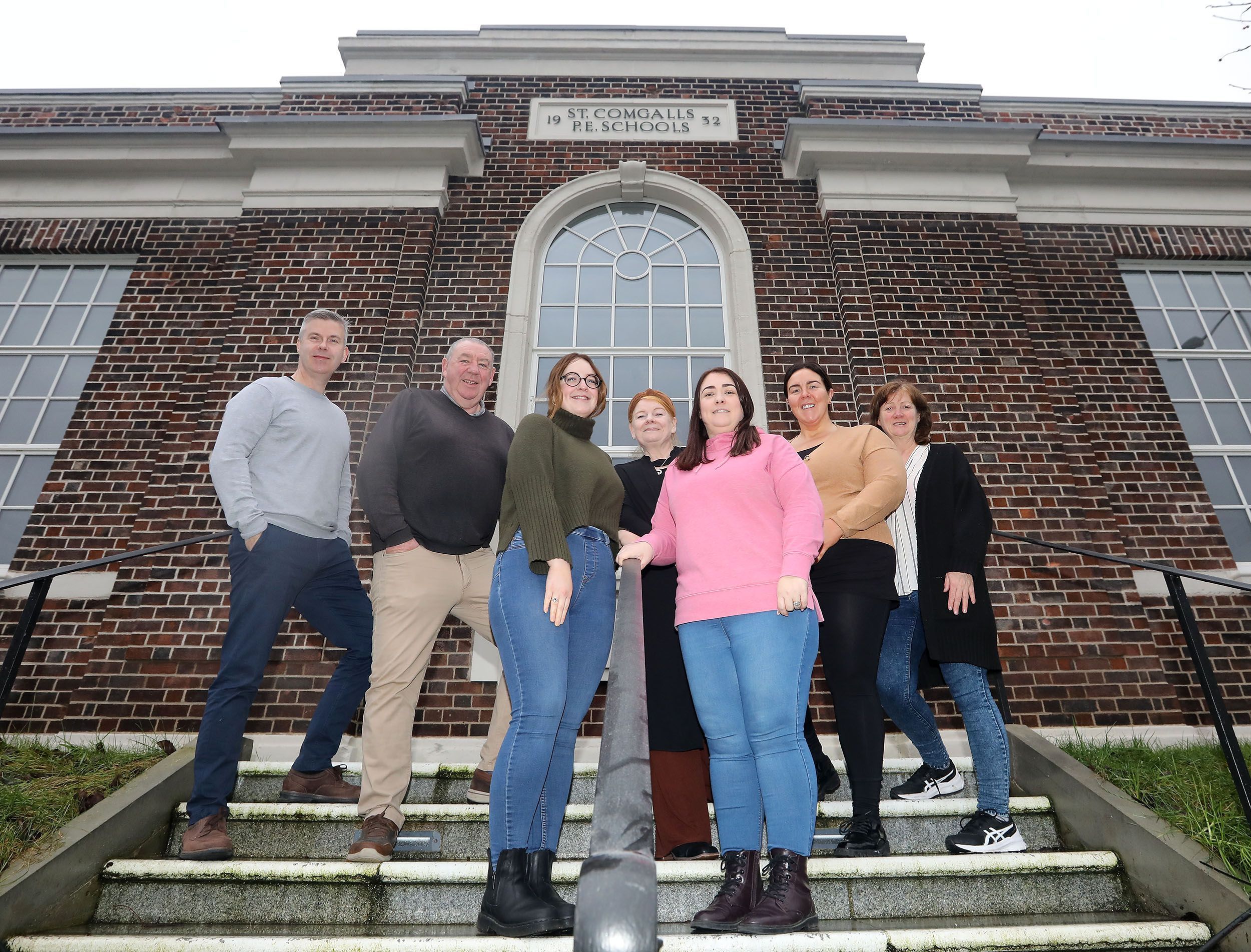 TREASURE: Staff of the Falls Community Council outside their new base at St Comgall\'s