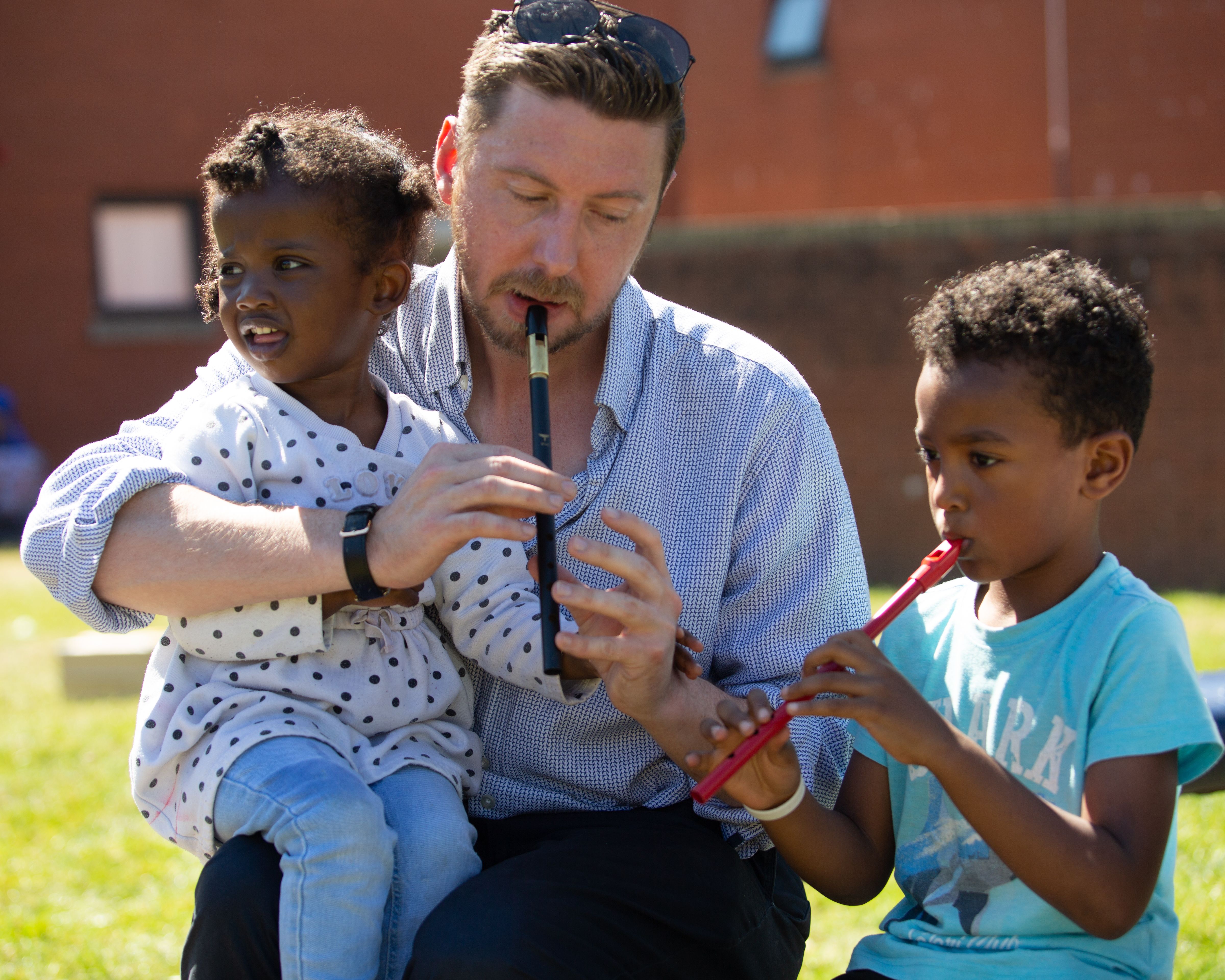 ART: Children at one of Ark\'s hostels learn to play music 