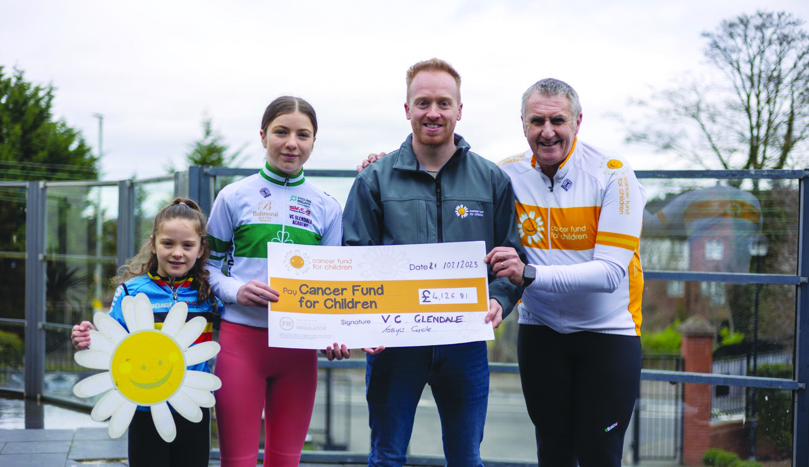 Fiadh and Aoife Craig from VCGlendale presenting Cormac McMullan & Eddie Marcus from Cancer Fund For Children with the cheque